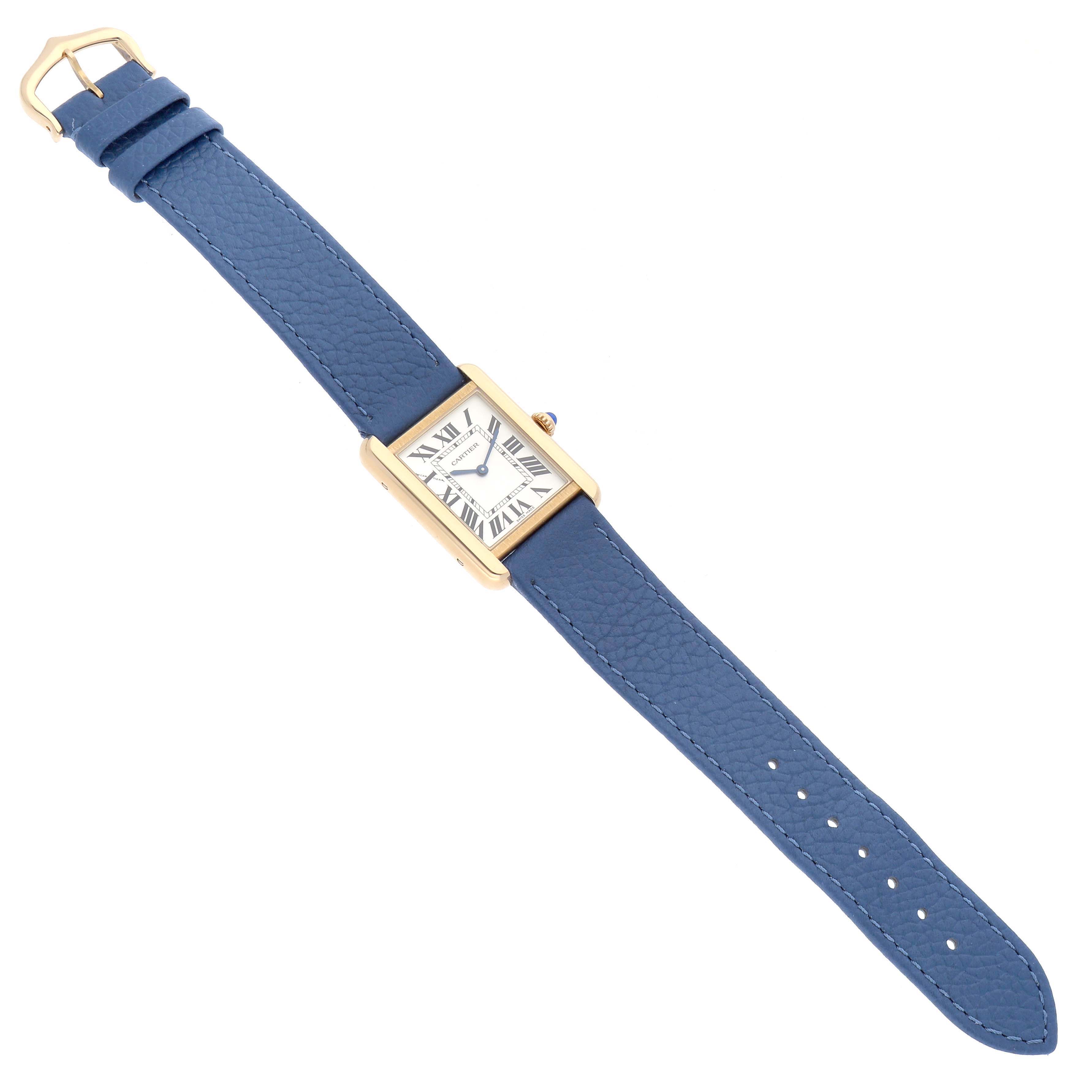 The Cartier Tank Solo W5200002 Women
s Yellow Gold Silver Dial watch is shown at an oblique angle, highlighting its face, blue strap, and gold-tone case.