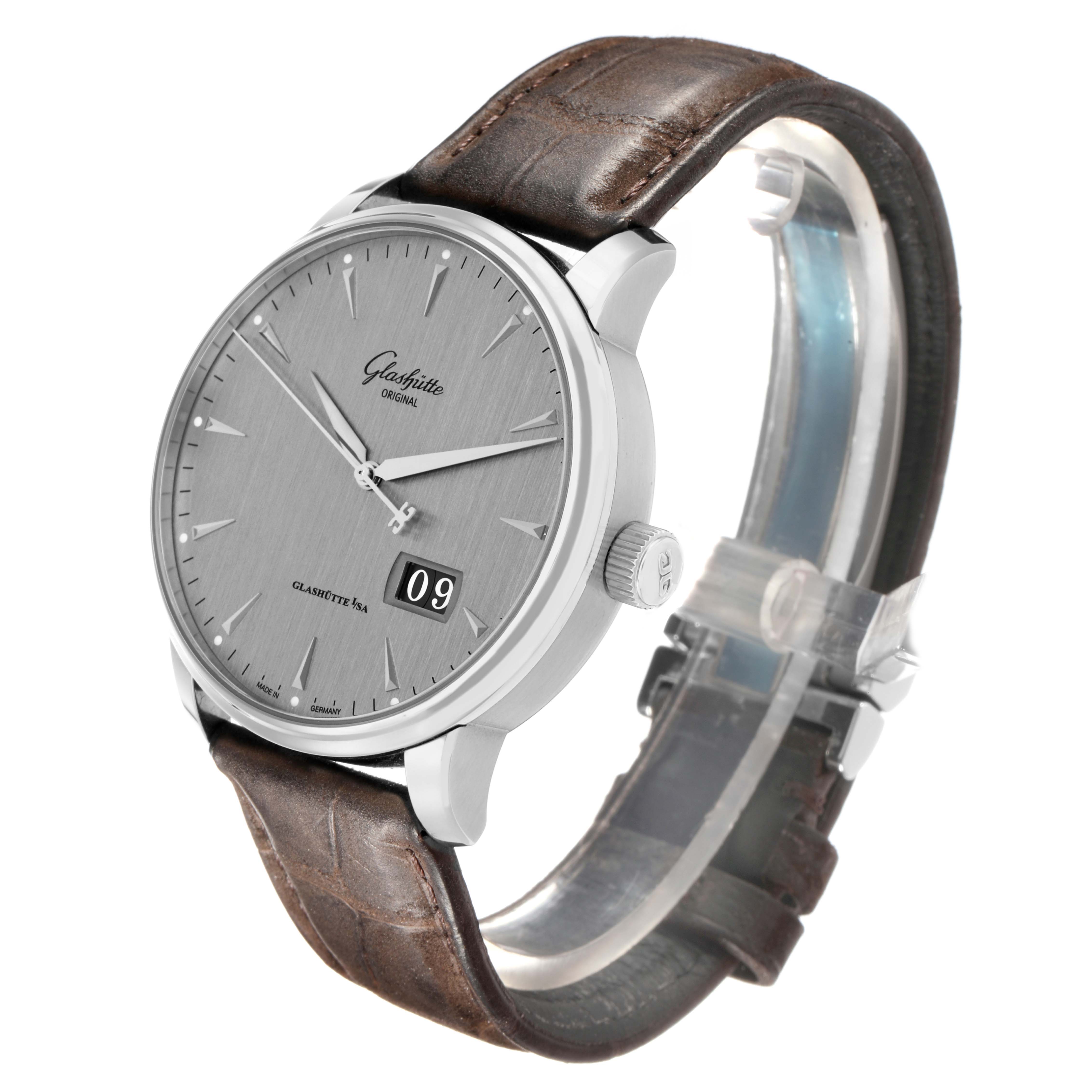 The Glashütte Senator watch is shown at a three-quarter angle, highlighting the dial, case, crown, and leather strap.