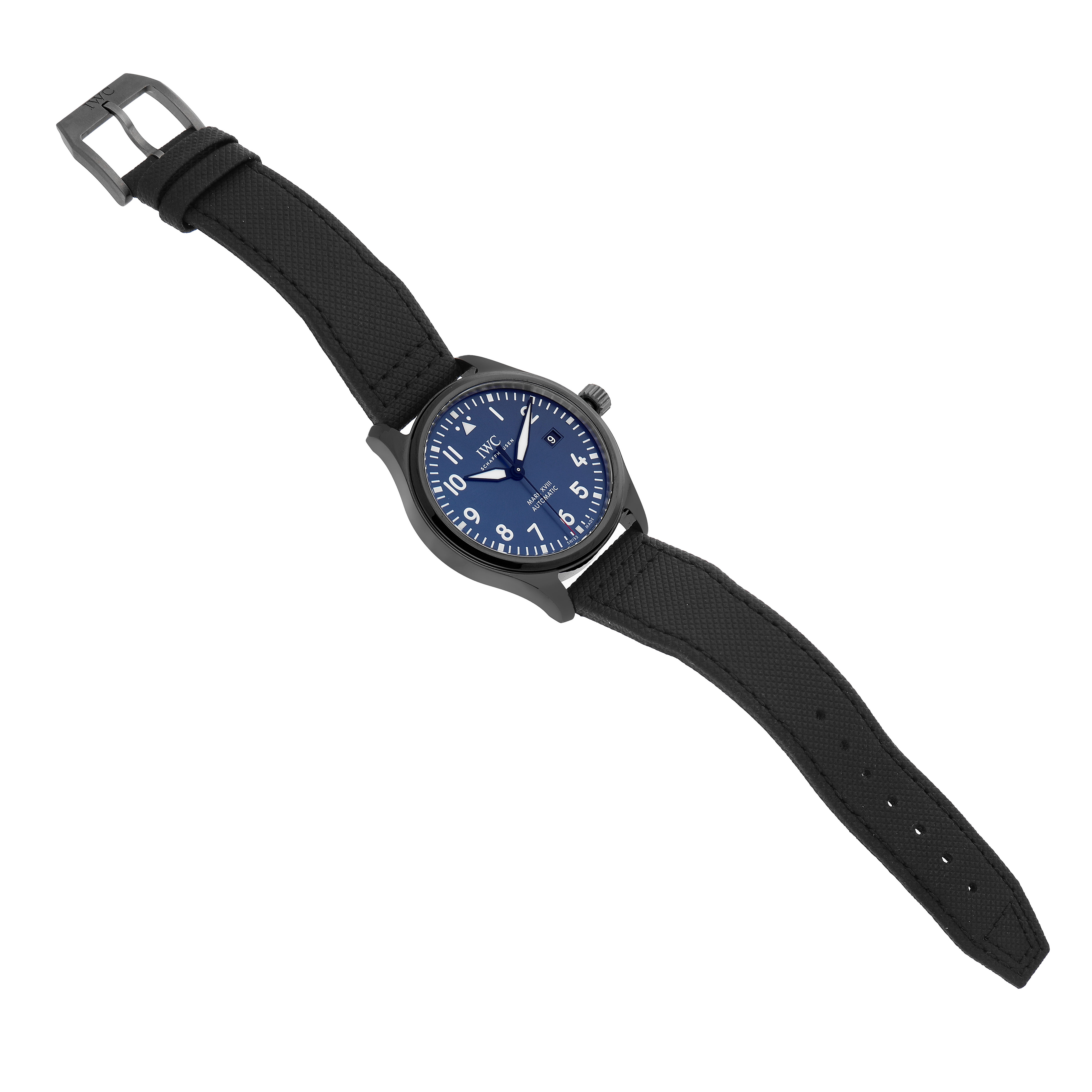 The IWC Pilot IW324703 Men's Ceramic Blue Dial model watch is shown at a slight top-down angle, displaying its face, strap, buckle, and crown.