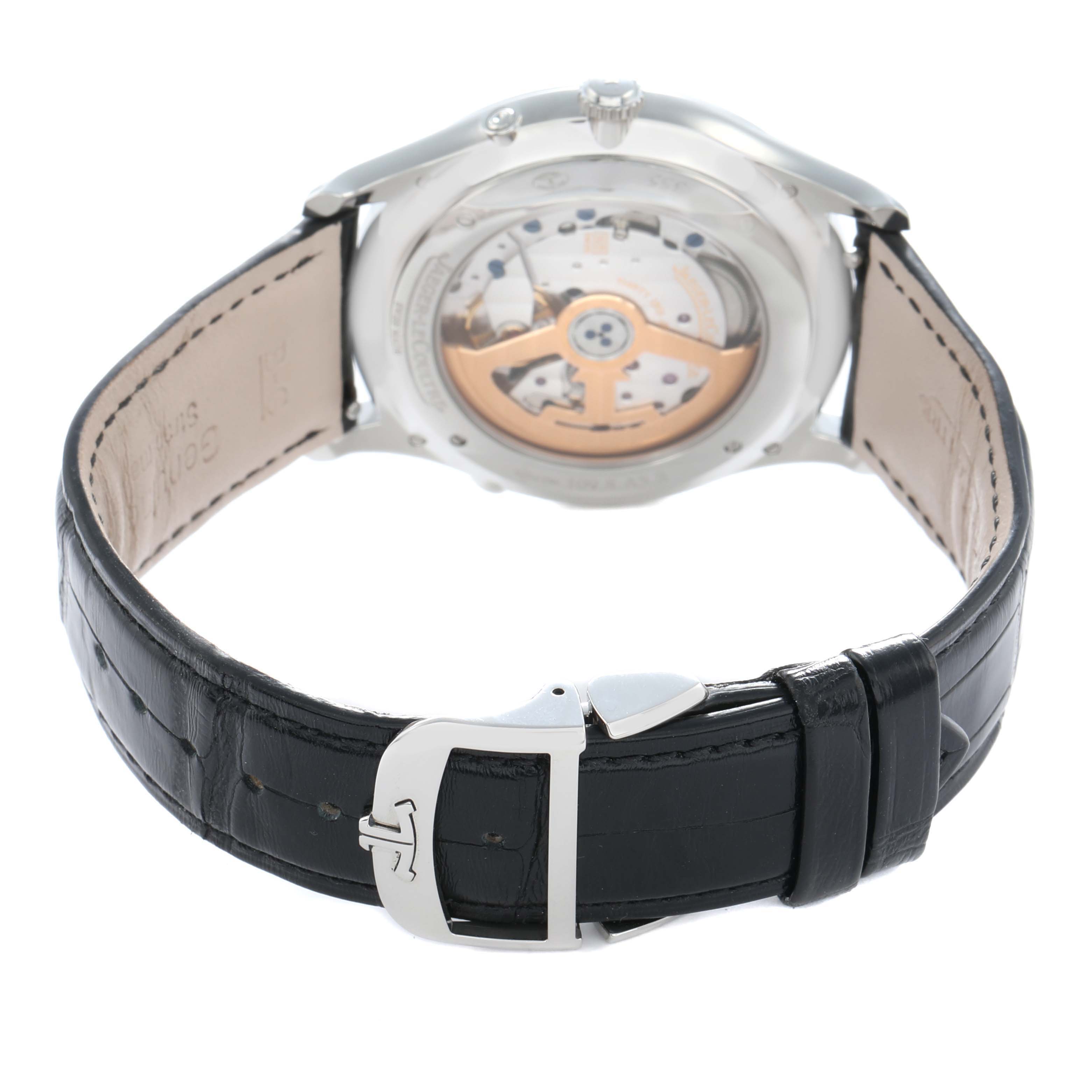The image shows the back of a Jaeger LeCoultre Master Q1368471 Men
s Stainless Steel Black Dial watch, highlighting its movement and black leather strap with a clasp.