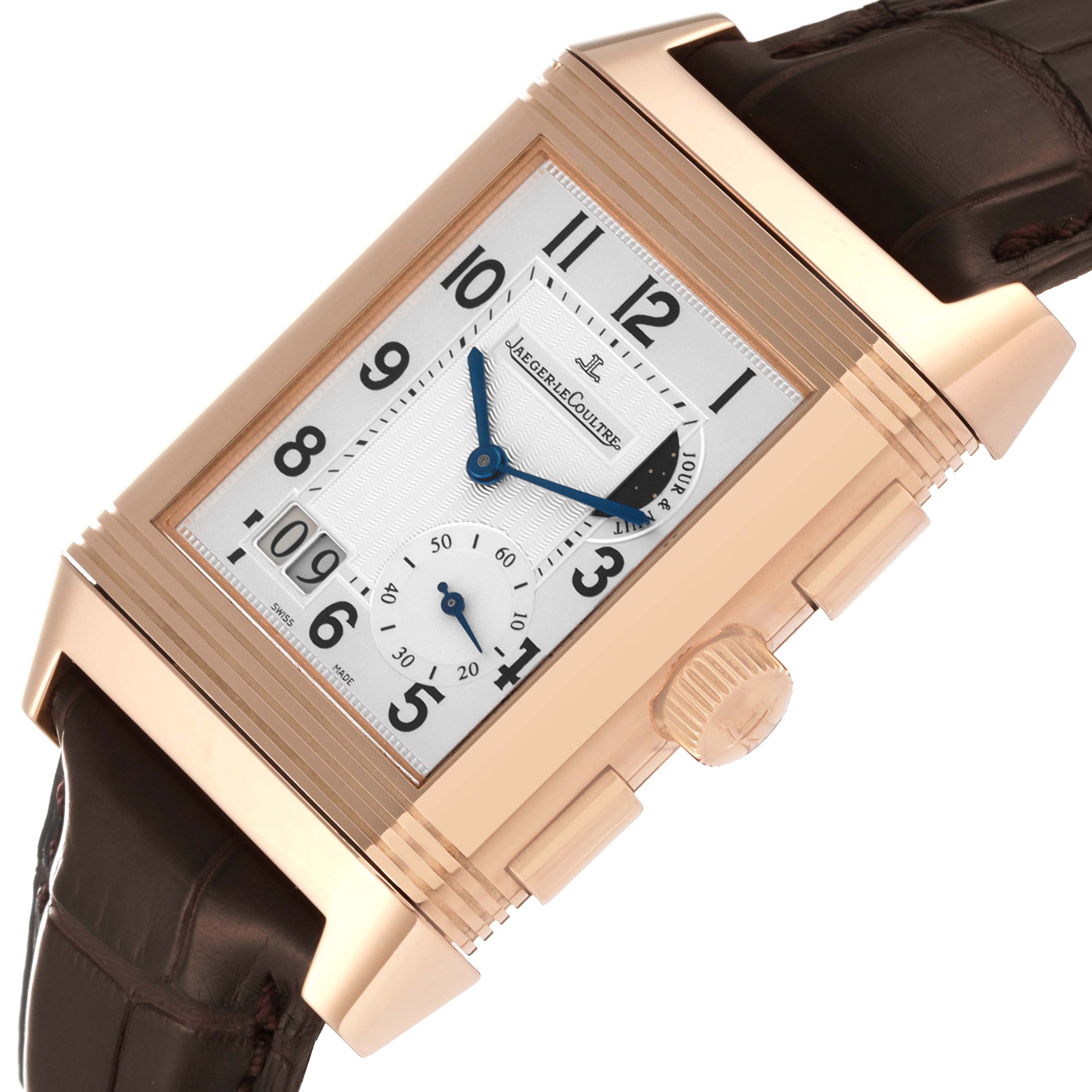 This image shows a close-up angle of the Jaeger-LeCoultre Reverso watch, highlighting its dial, crown, and part of the leather strap.
