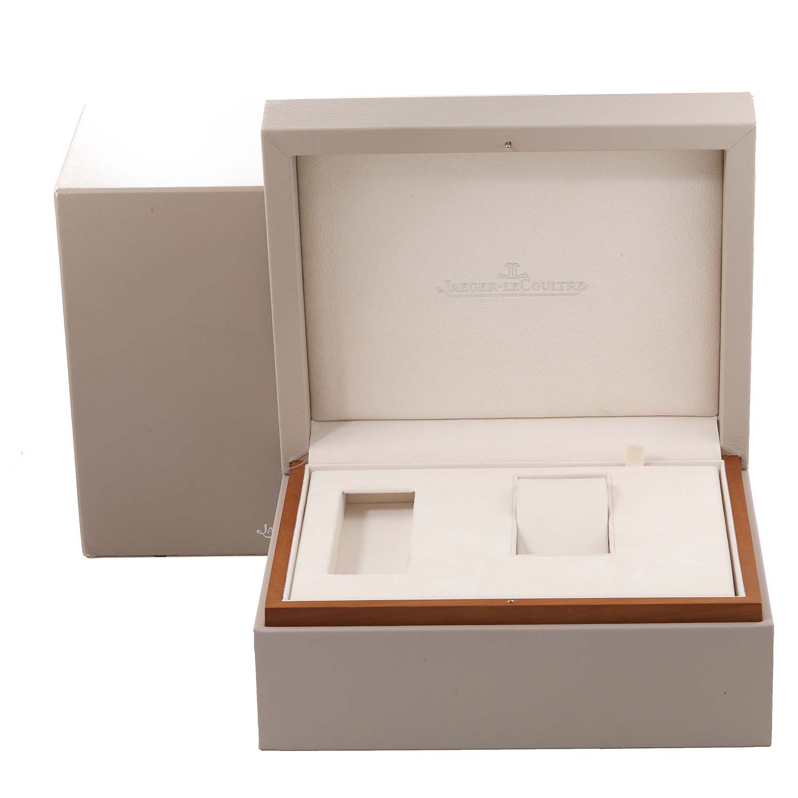 This image shows an open Jaeger LeCoultre Reverso Q3022420 Men's Rose Gold Silver Dial Q3022420 Men's Rose Gold Silver Dial watch box, with compartments for housing the watch and accessories.