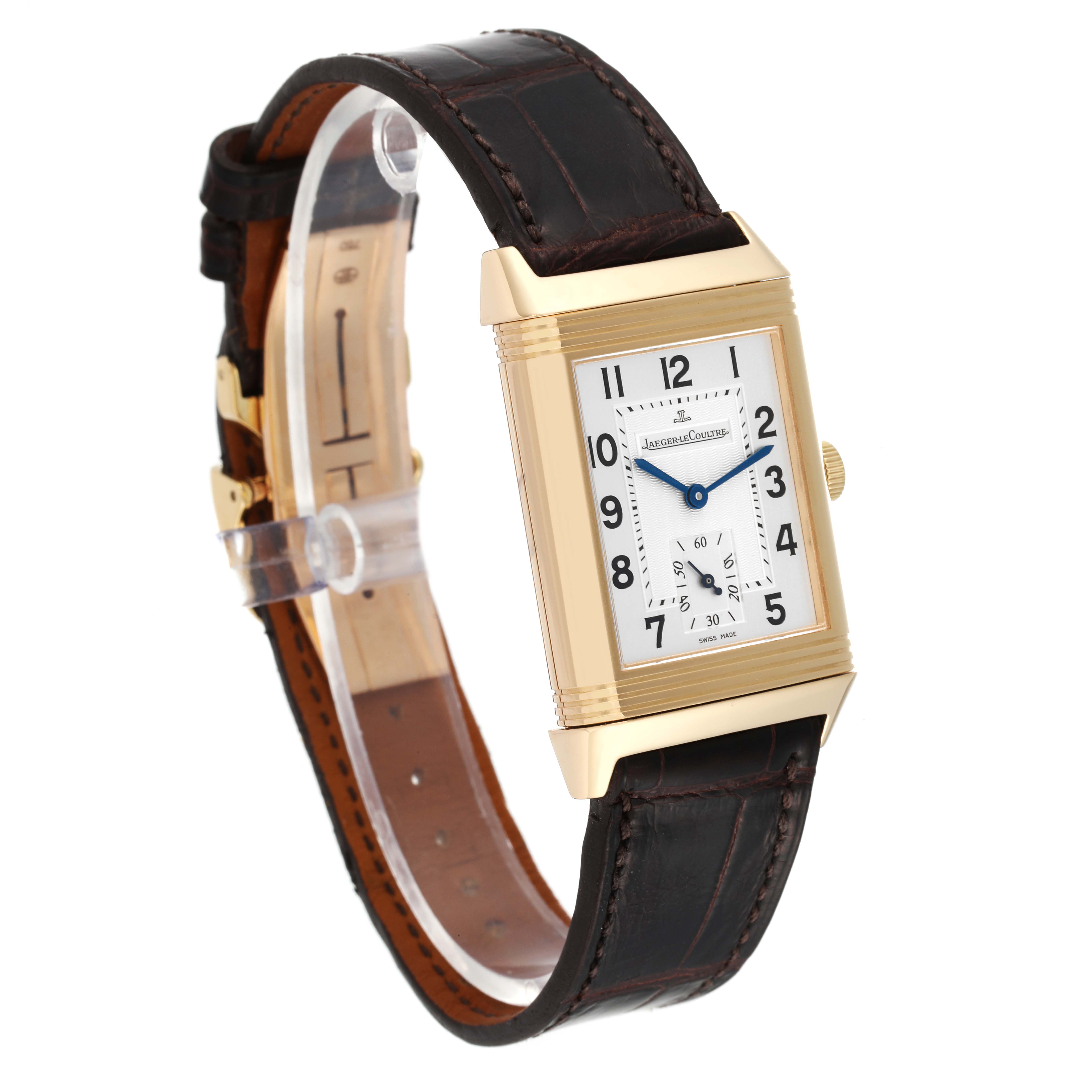 The image shows a front-side angle of a Jaeger-LeCoultre Reverso watch with a rectangular case and brown leather strap.