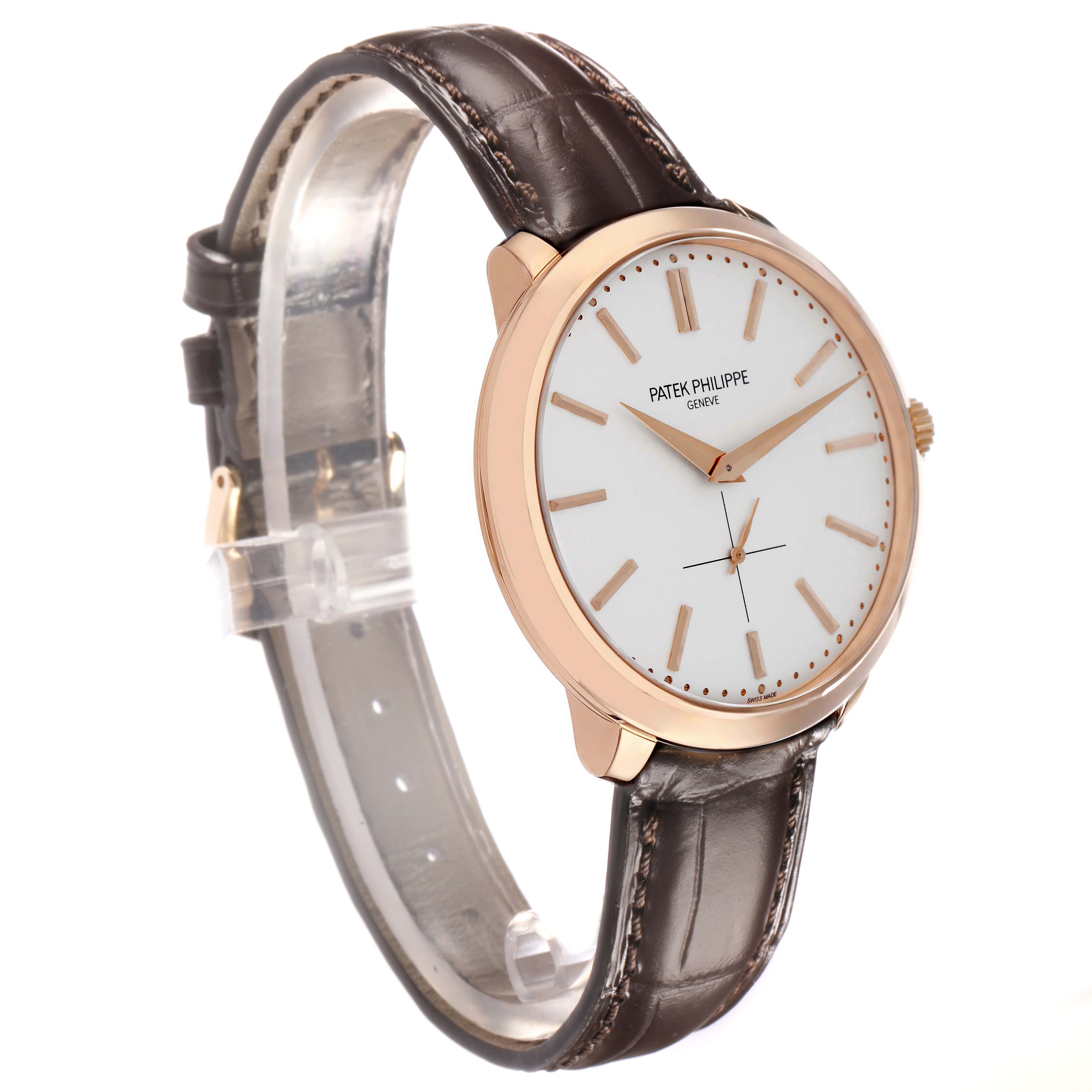 The Patek Philippe Calatrava 5123 Men
s Rose Gold Silver Dial watch is shown at a tilted angle, displaying the face, case, crown, and leather strap.