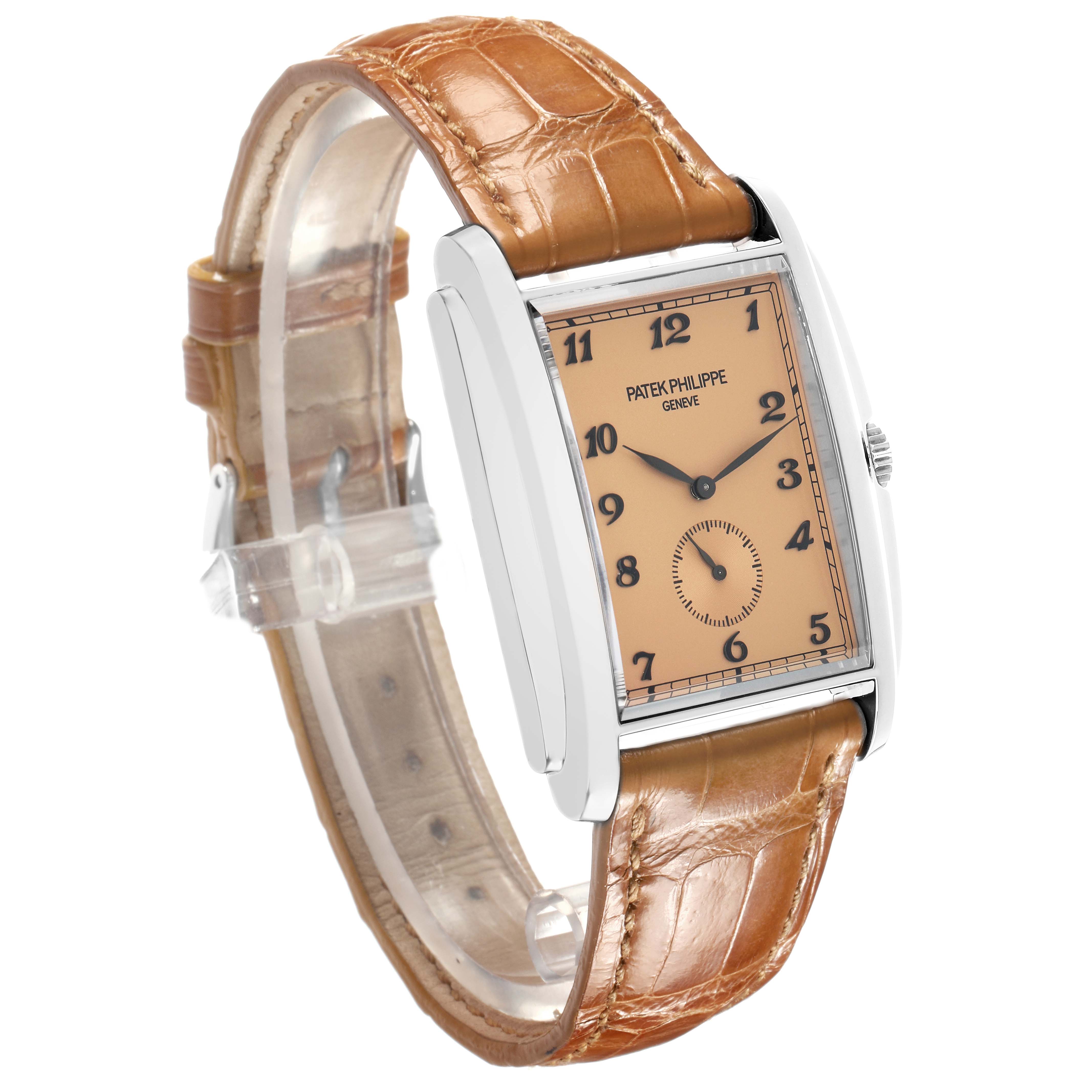 The Patek Philippe Gondolo 5124G Men
s White Gold Brown Dial watch is shown at a side angle, highlighting its rectangular dial and brown leather strap with a silver case.