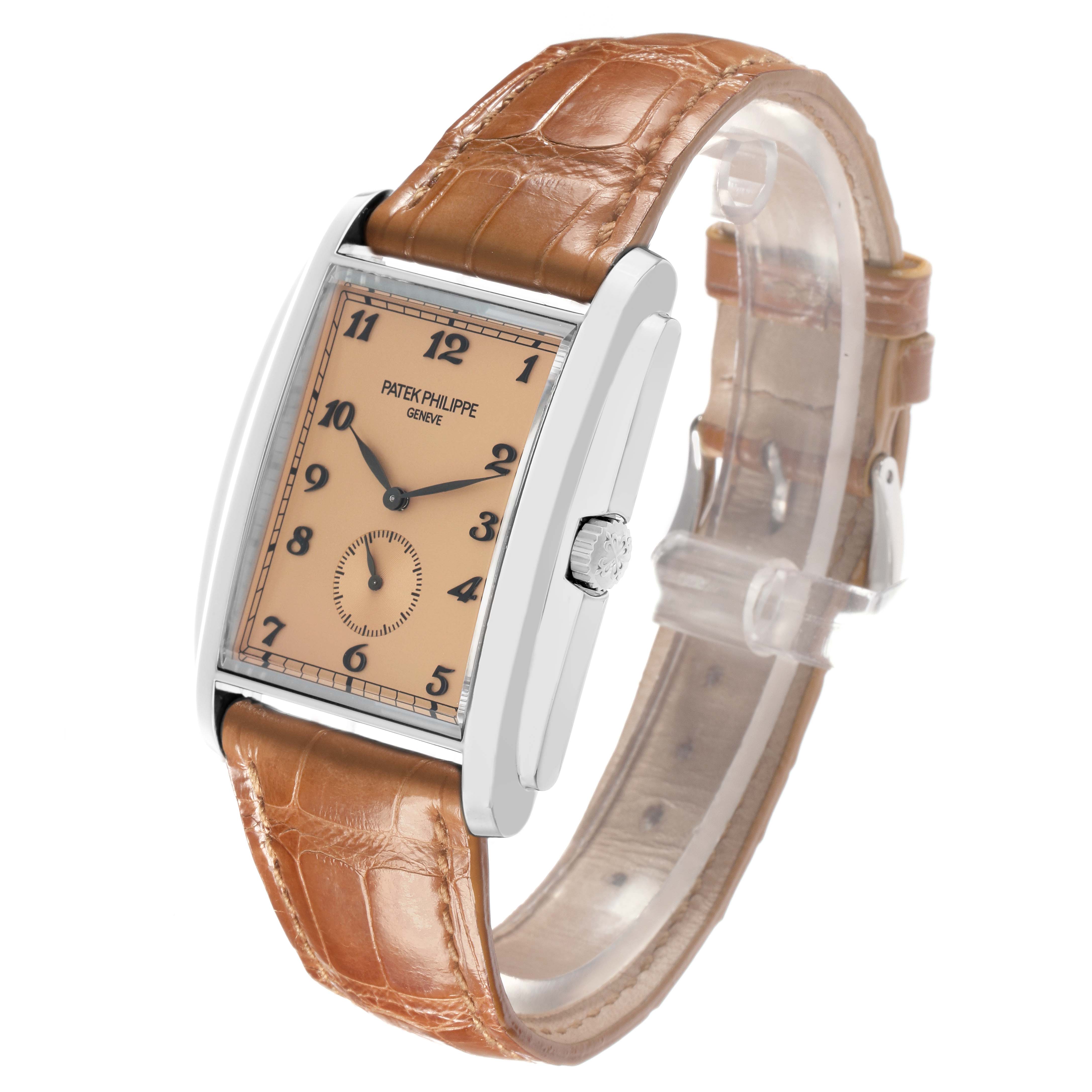 The Patek Philippe Gondolo 5124G Men
s White Gold Brown Dial watch is shown at a three-quarter angle, featuring its face, side, and brown leather strap.