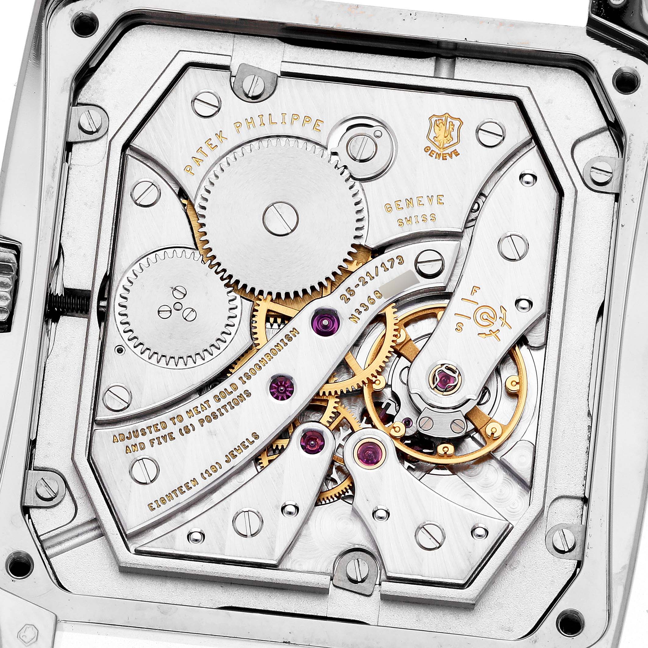 The image shows the movement of a Patek Philippe Gondolo 5124G Men
s White Gold Brown Dial watch, highlighting the gears and mechanical components from the back.
