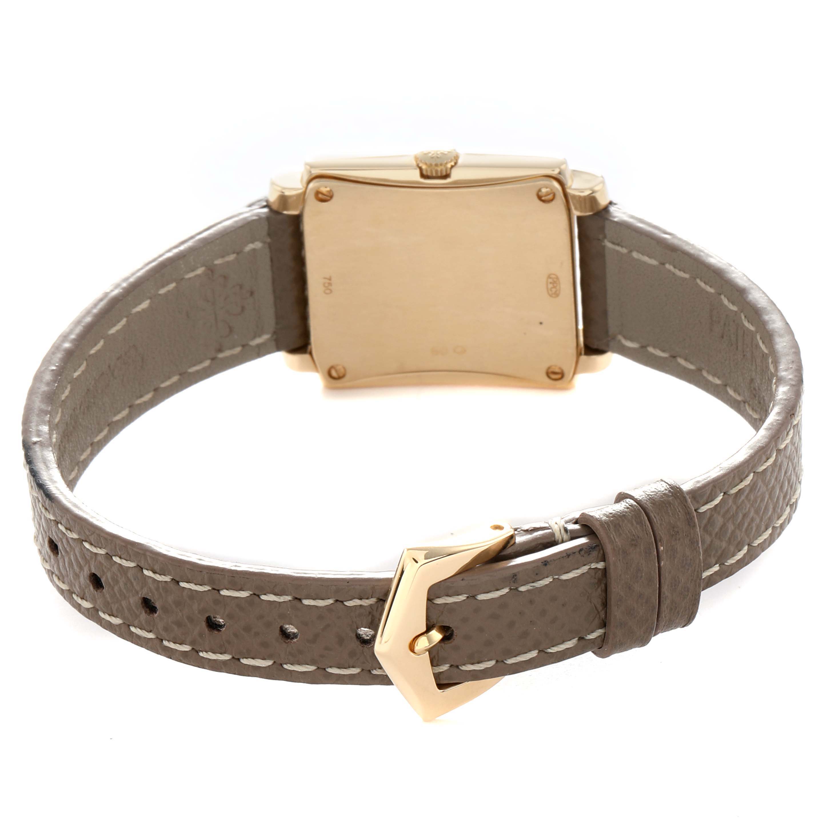 The image shows the back view of the Patek Philippe Gondolo 4824J Women
s Yellow Gold White Dial watch, highlighting the case back, crown, and leather strap with buckle.