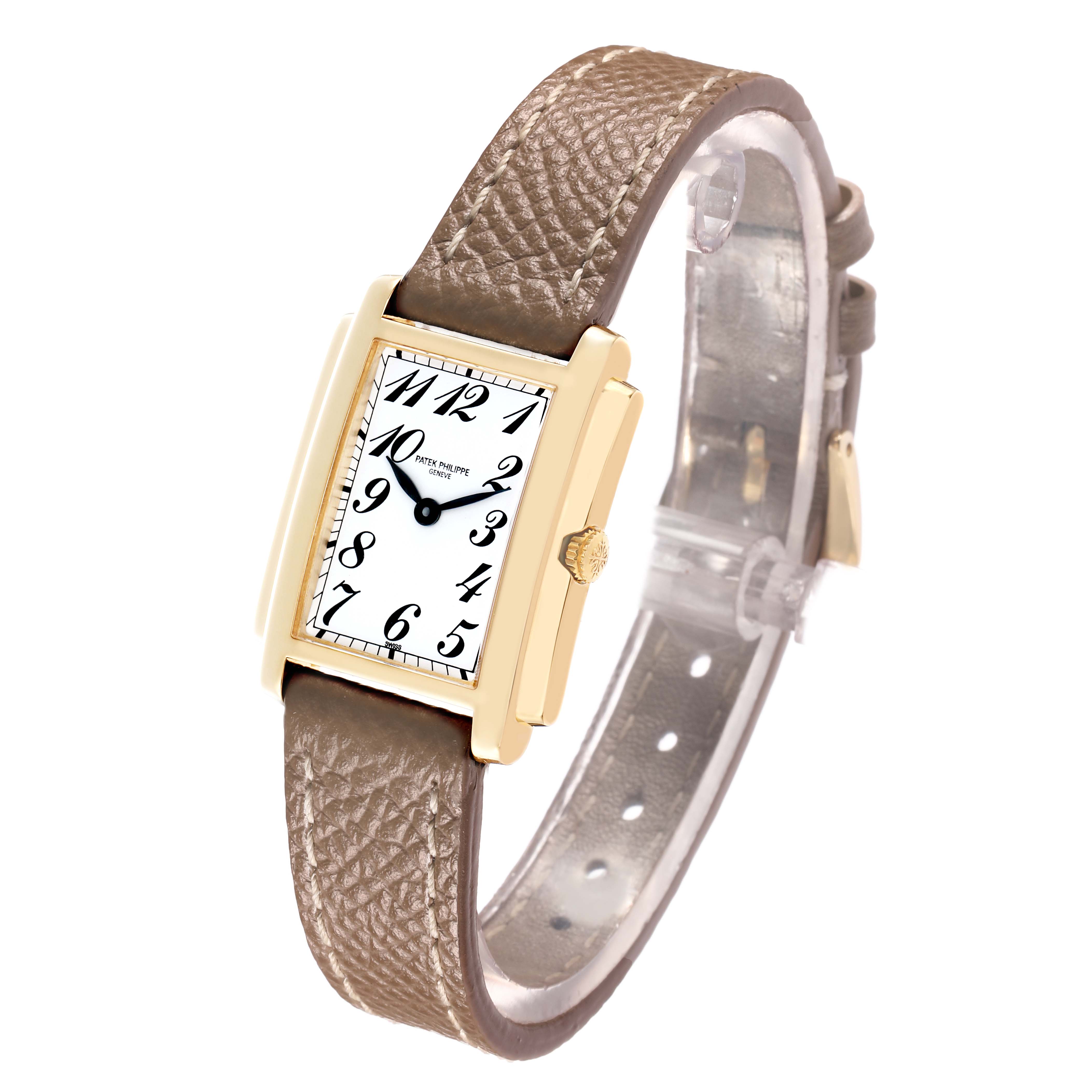 The image shows a Patek Philippe Gondolo 4824J Women
s Yellow Gold White Dial watch from a front-side angle, displaying the face, bezel, dial, and brown leather strap.