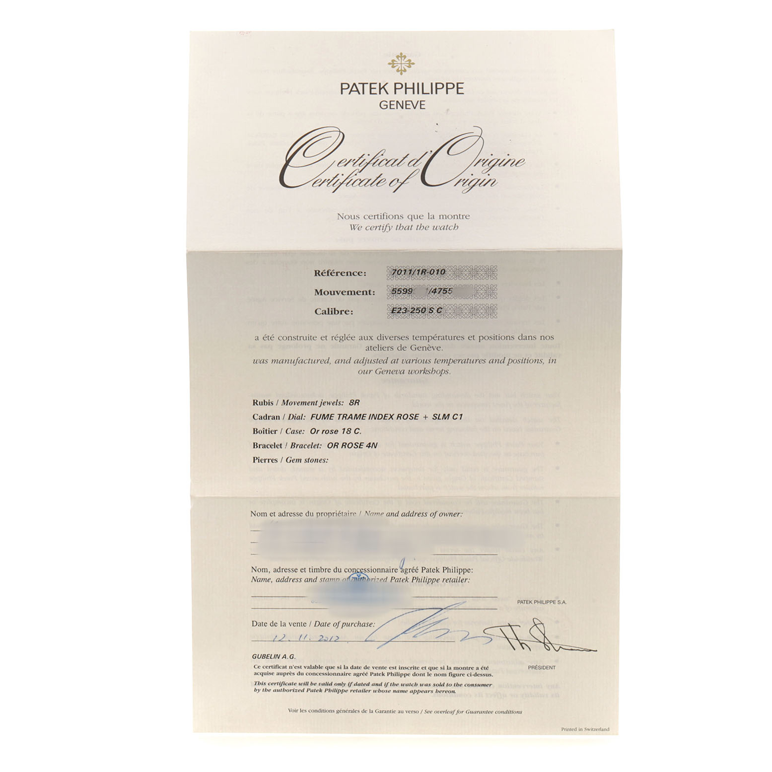 This image shows a certificate of origin for a Patek Philippe Nautilus 7011/1R-010 Women's Rose Gold Grey Dial model watch.