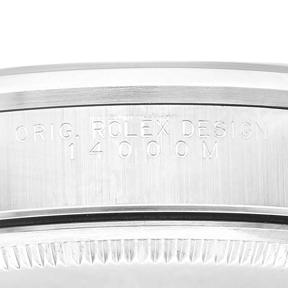 The image shows a close-up of the side of a Rolex Air-King 14000 Men's Stainless Steel Blue Dial 14000 Men's Stainless Steel Blue Dial watch case featuring engravings.