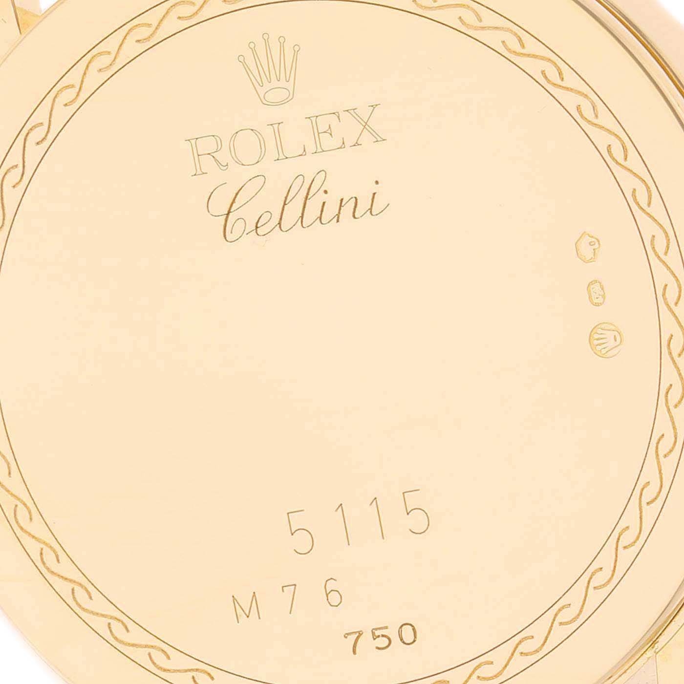 The image shows the engraved case back interior of a Rolex Cellini 5115 Men
s Yellow Gold Champagne Dial 5115 Men
s Yellow Gold Champagne Dial model with its serial number and hallmarks.