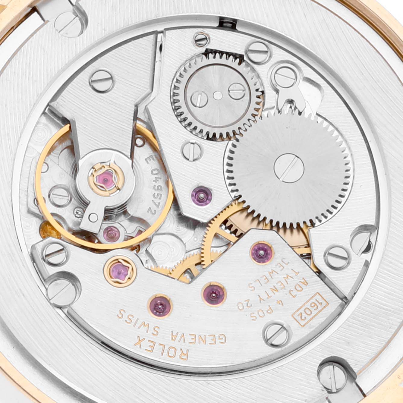 This image shows the intricate internal mechanism of the Rolex Cellini 5115 Men
s Yellow Gold Champagne Dial 5115 Men
s Yellow Gold Champagne Dial watch, highlighting gears and components from a top-down angle.