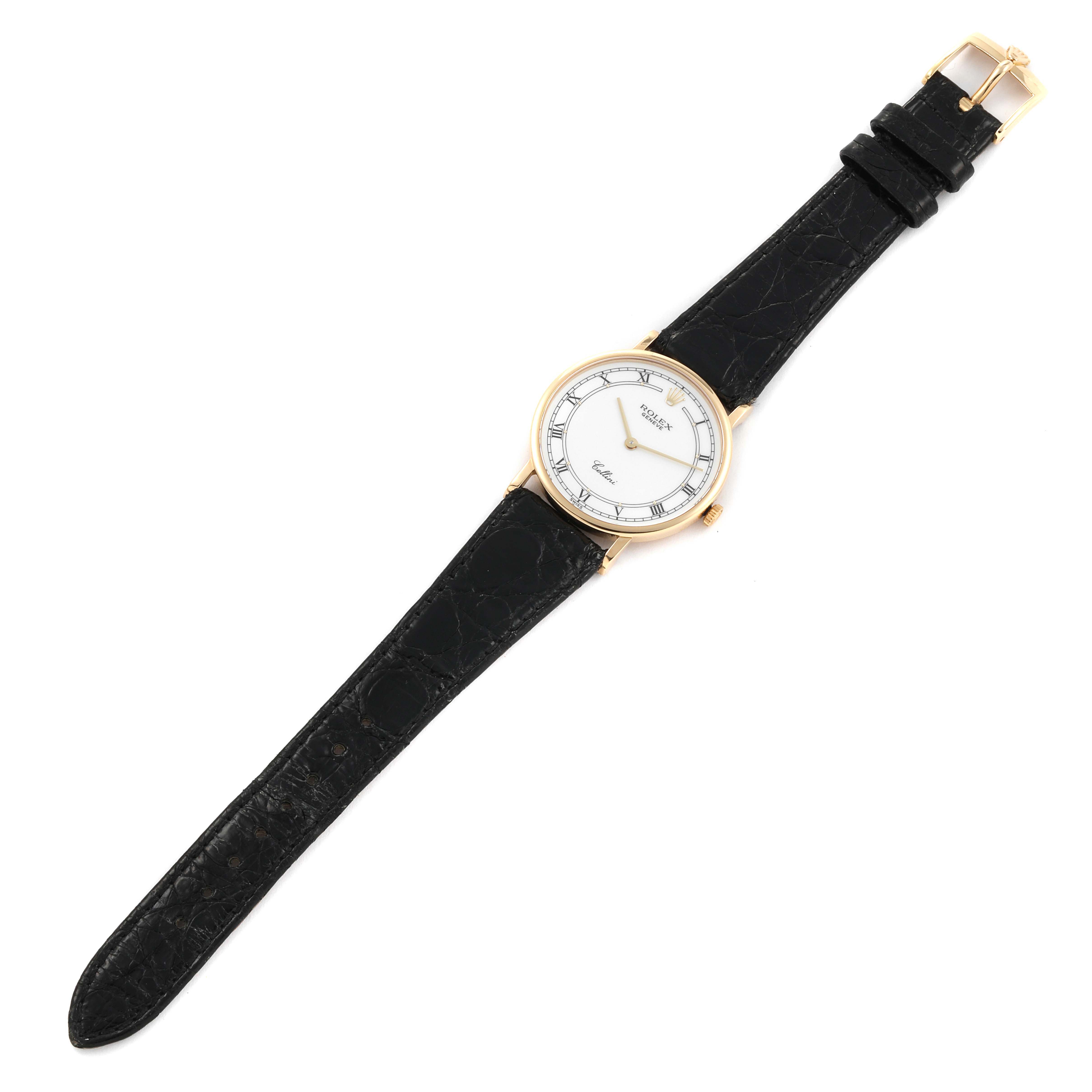 This image shows a full view of the Rolex Cellini 5112 Men's Yellow Gold White Dial 5112 Men's Yellow Gold White Dial watch, highlighting its black leather strap, white dial, and gold case.