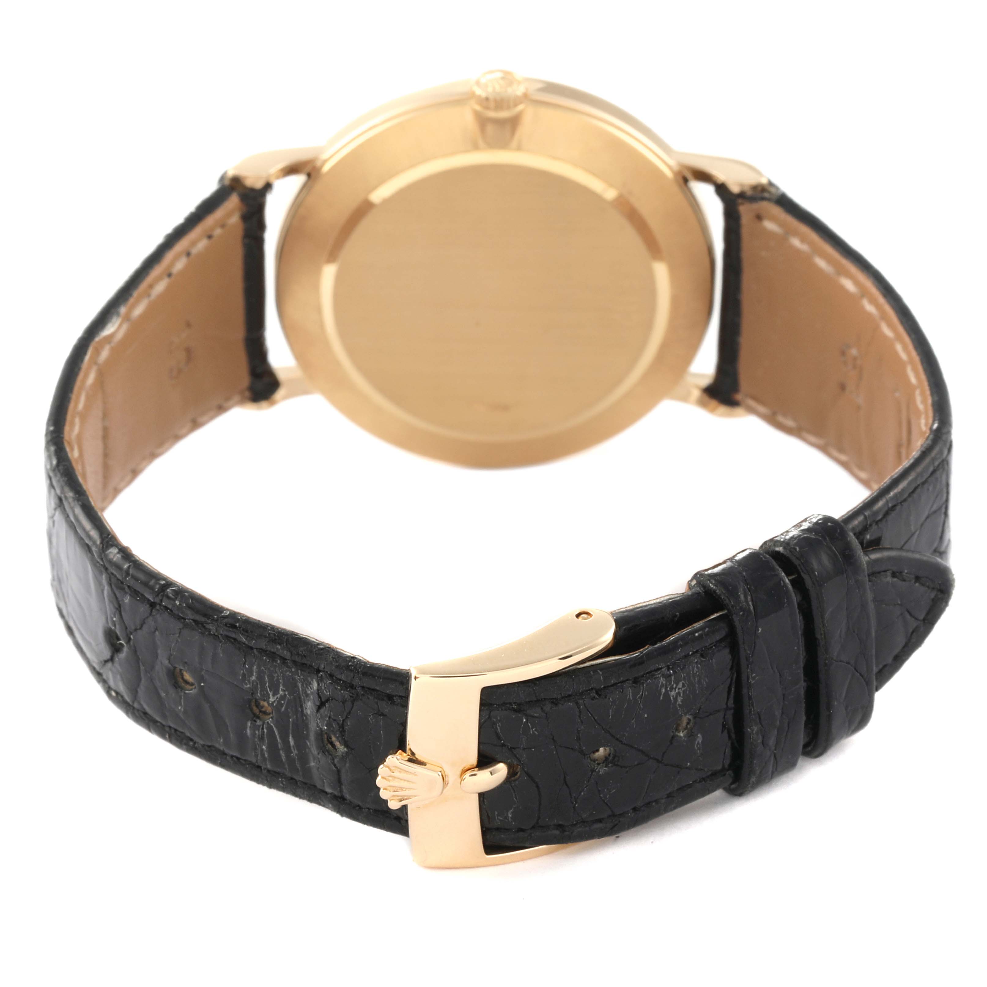 The image shows the back view of a Rolex Cellini 5112 Men's Yellow Gold White Dial 5112 Men's Yellow Gold White Dial watch, highlighting its case back and leather strap with a deployant clasp.