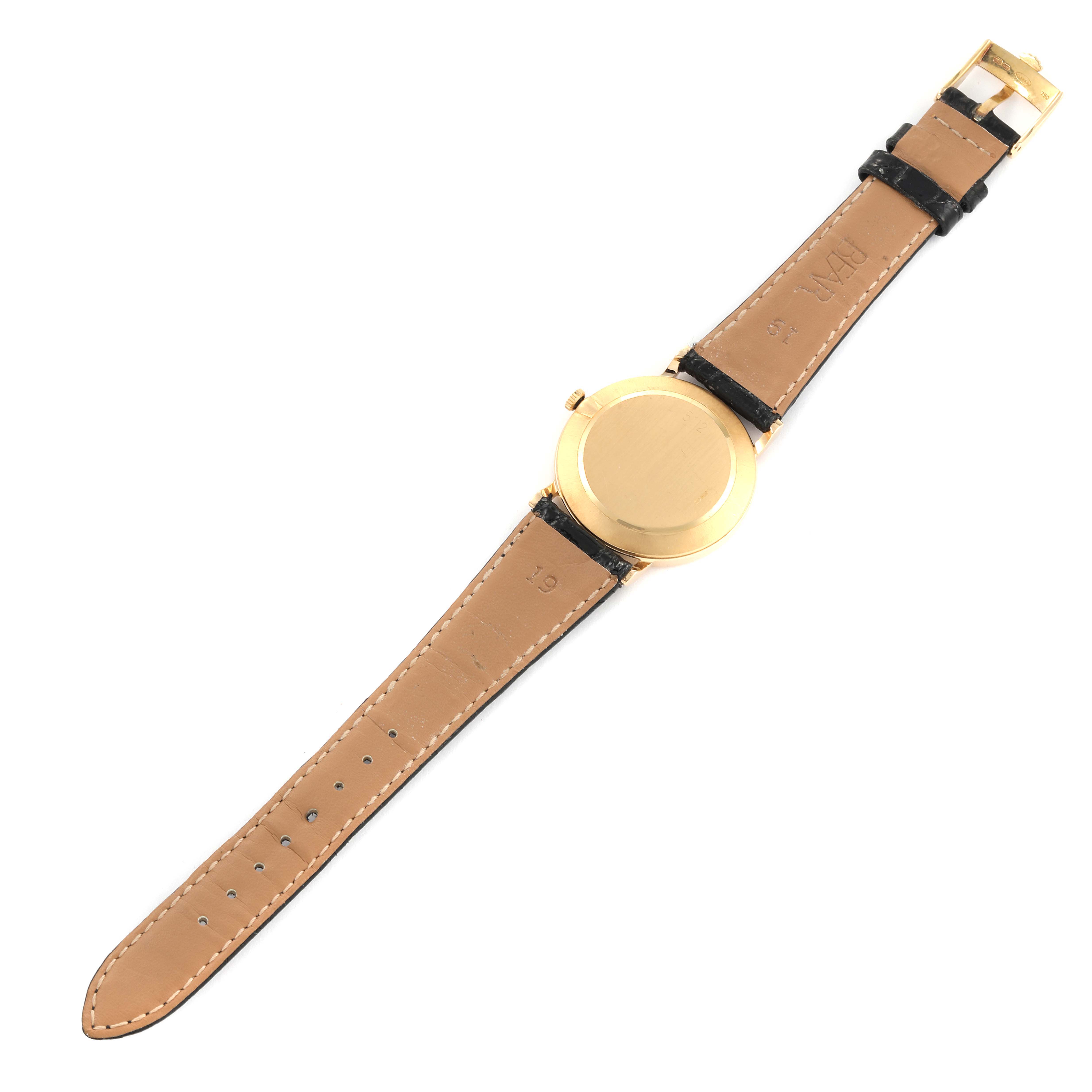 The image shows the back of a Rolex Cellini 5112 Men's Yellow Gold White Dial 5112 Men's Yellow Gold White Dial watch, showcasing its leather strap and gold case from a top-down angle.