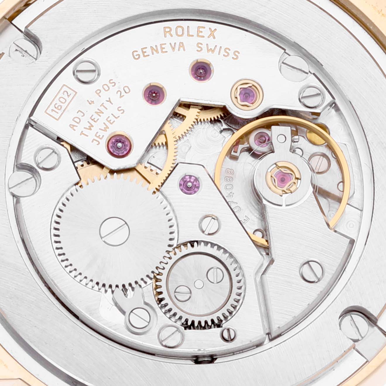 This image shows a close-up of the internal movement parts of a Rolex Cellini 5115 Men's Yellow Gold Mother of Pearl Dial 5115 Men's Yellow Gold Mother of Pearl Dial model watch, highlighting gears and jewels.