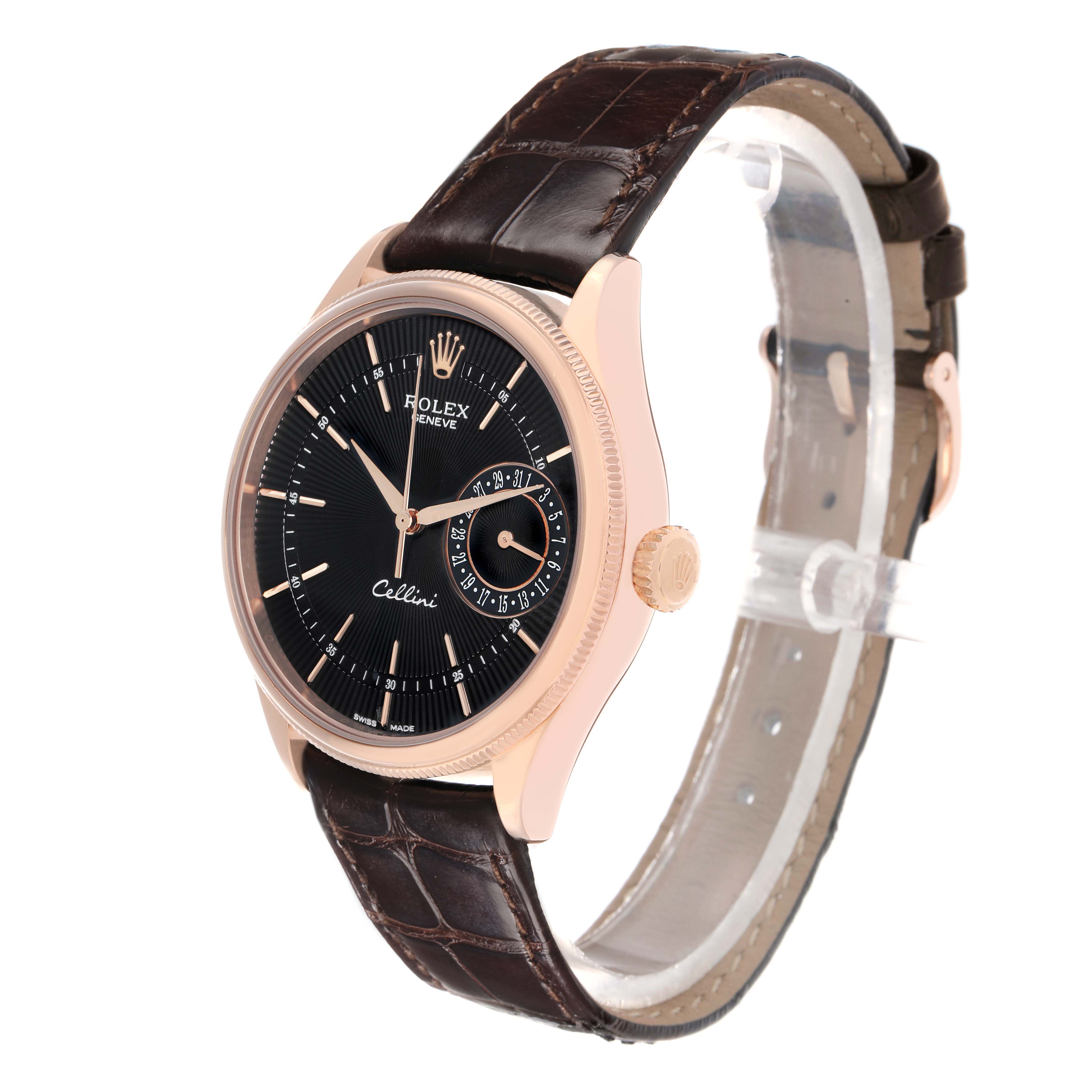 The Rolex Cellini 50515 Men
s Rose Gold Black Dial watch is shown at a three-quarter angle, displaying its face, crown, and leather strap.