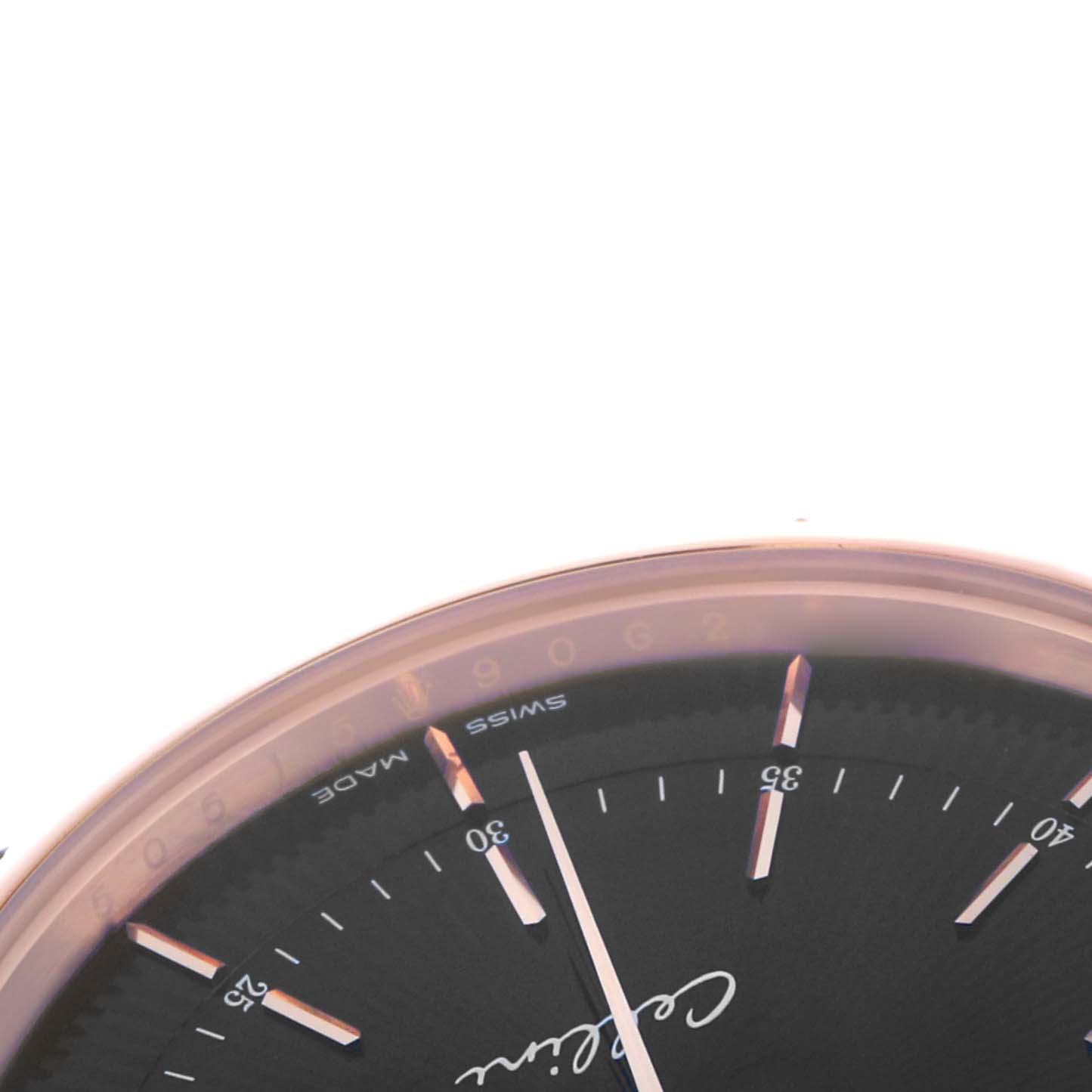 The angle shows a close-up of the top left portion of the Rolex Cellini 50515 Men
s Rose Gold Black Dial watch face, highlighting the dial and markers.