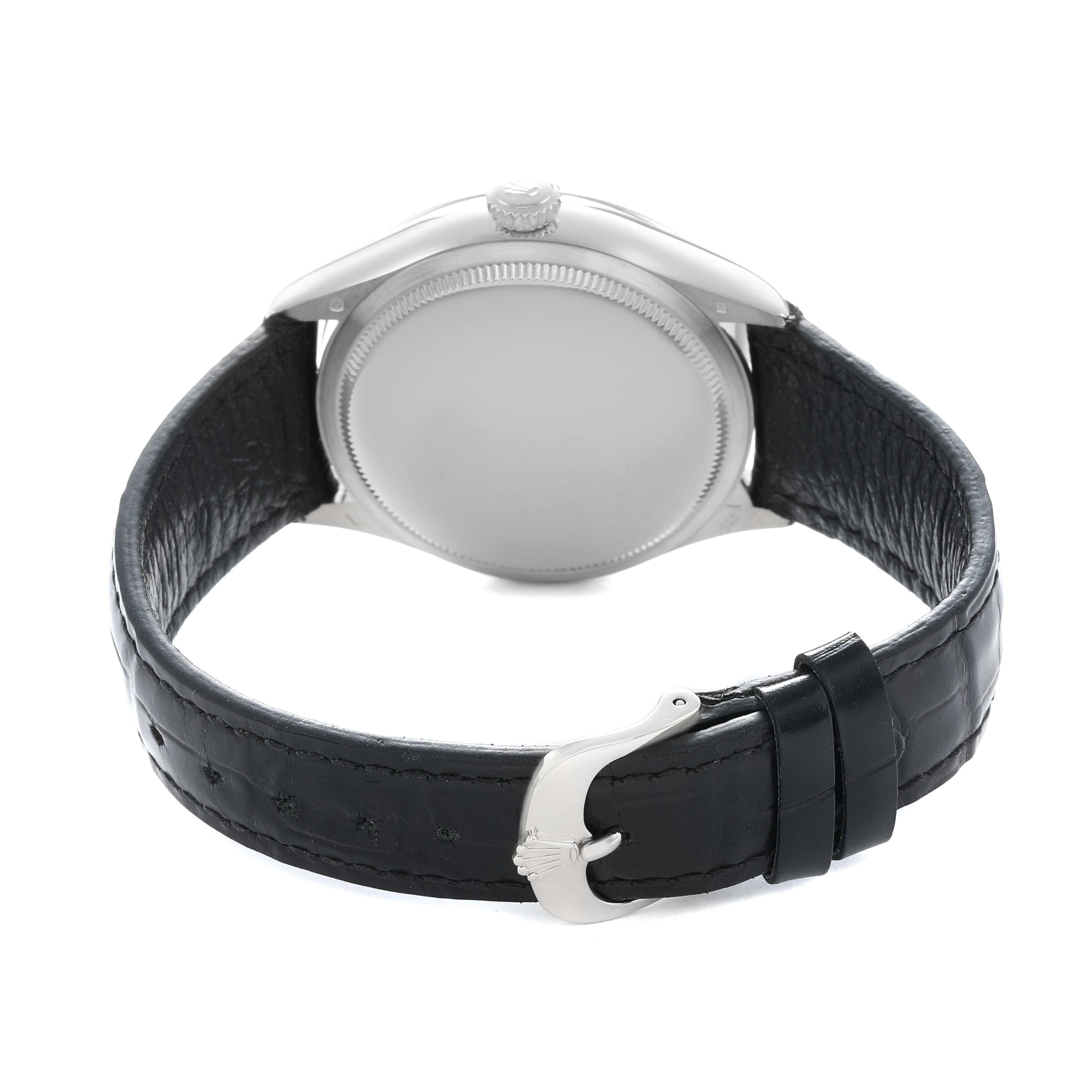 The Rolex Cellini 50519 Men
s White Gold Silver Dial watch is shown from the back, highlighting the case back and leather strap with a buckle.