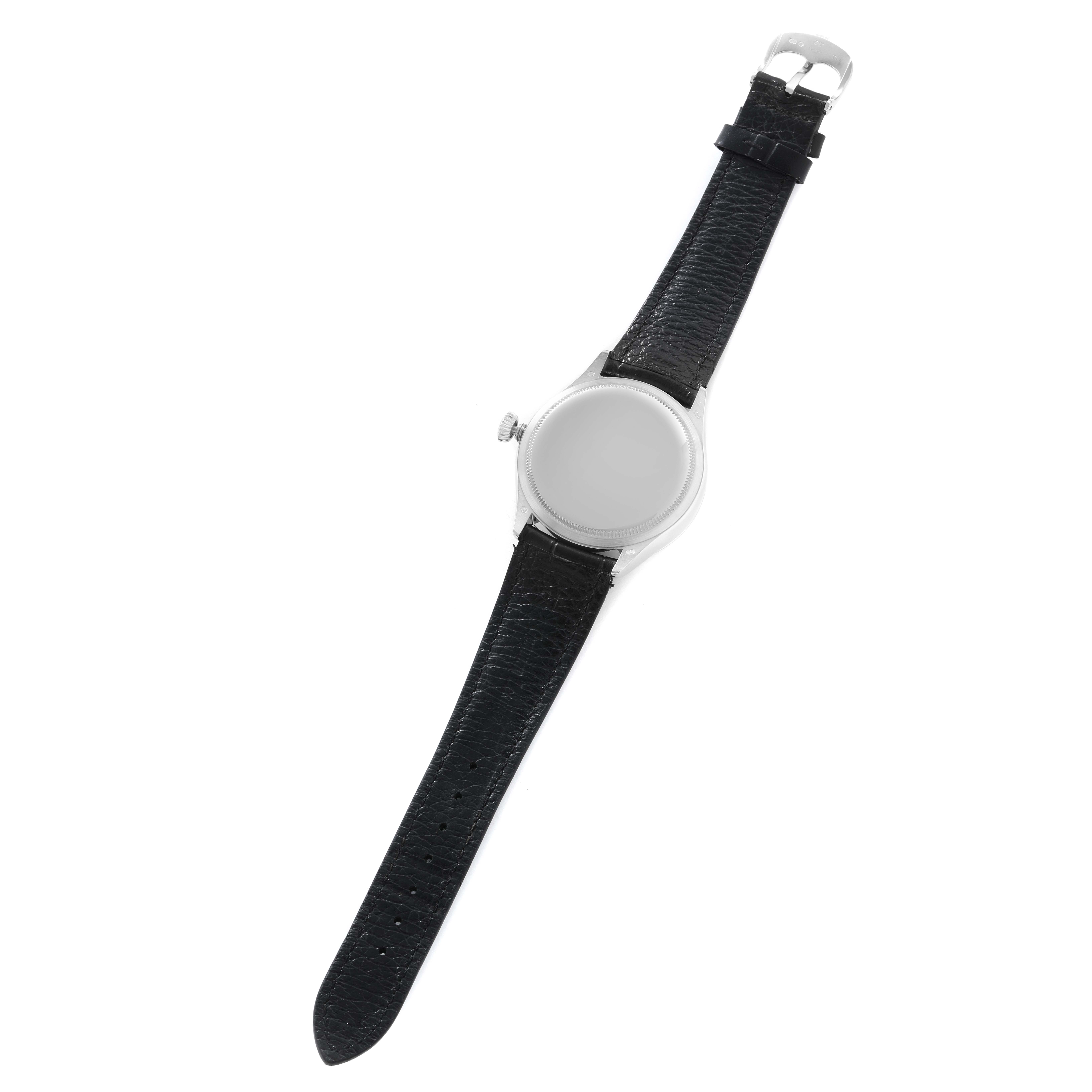 The Rolex Cellini 50519 Men
s White Gold Silver Dial watch is shown from a top view, displaying its round case, crown, and black leather strap.