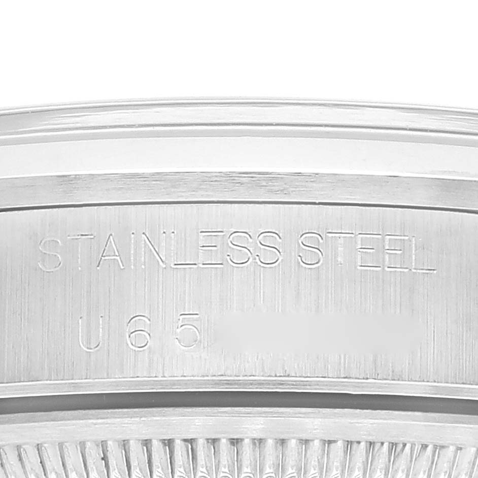 The image shows a close-up of the case back edge of a Rolex Date 15200 Men
s Stainless Steel Black Dial 15200 Men
s Stainless Steel Black Dial model watch, highlighting the "STAINLESS STEEL" engraving.