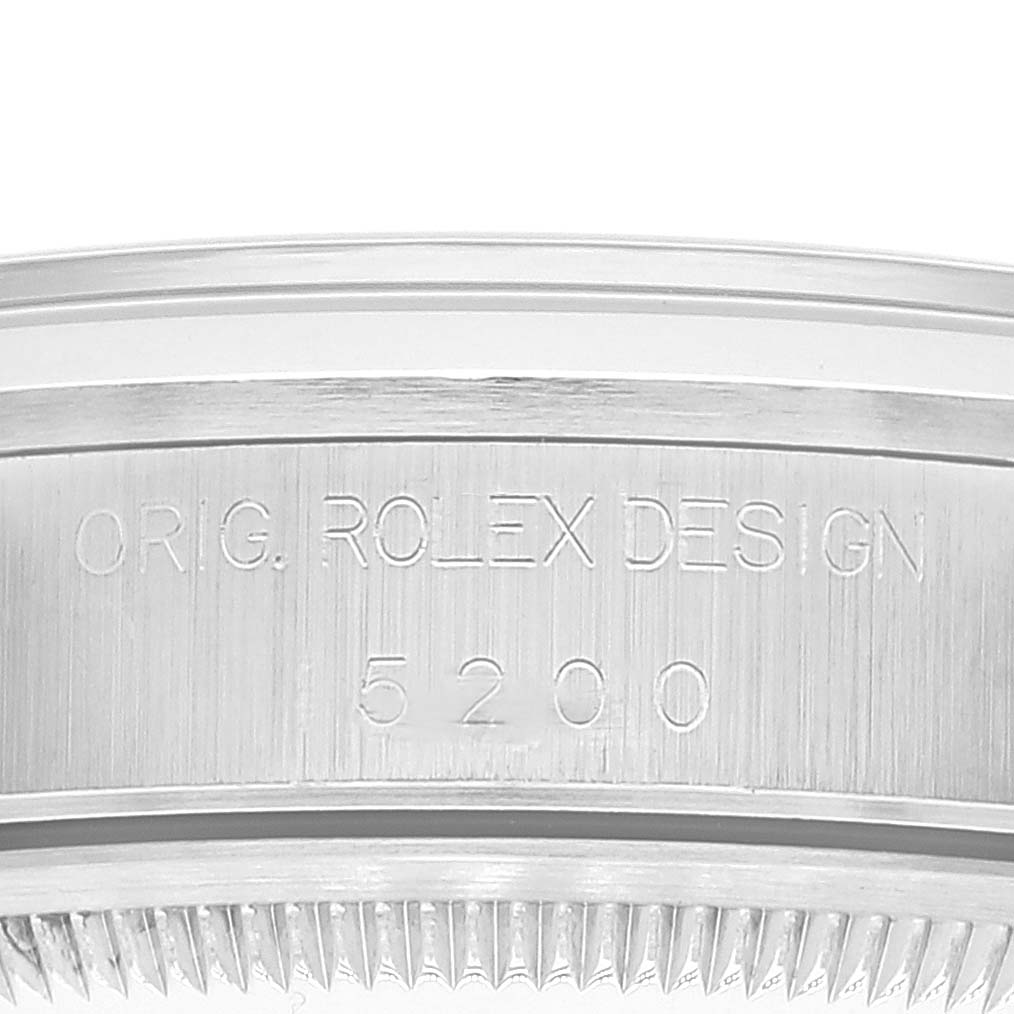 This image shows a close-up view of the engraved side of the bezel of a Rolex Date 15200 Men
s Stainless Steel Black Dial 15200 Men
s Stainless Steel Black Dial model watch.