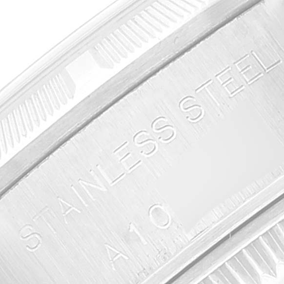 This is a close-up of the case back edge of a Rolex Date 69190 Women's Stainless Steel Blue Dial 69190 Women's Stainless Steel Blue Dial model showing the "STAINLESS STEEL" engraving.