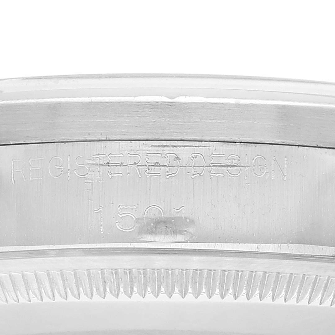 The image shows a close-up of the case side of a Rolex Vintage Collection 1501 Men
s Stainless Steel Silver Dial 1501 Men
s Stainless Steel Silver Dial model, highlighting the "Registered Design 1501" engraving.
