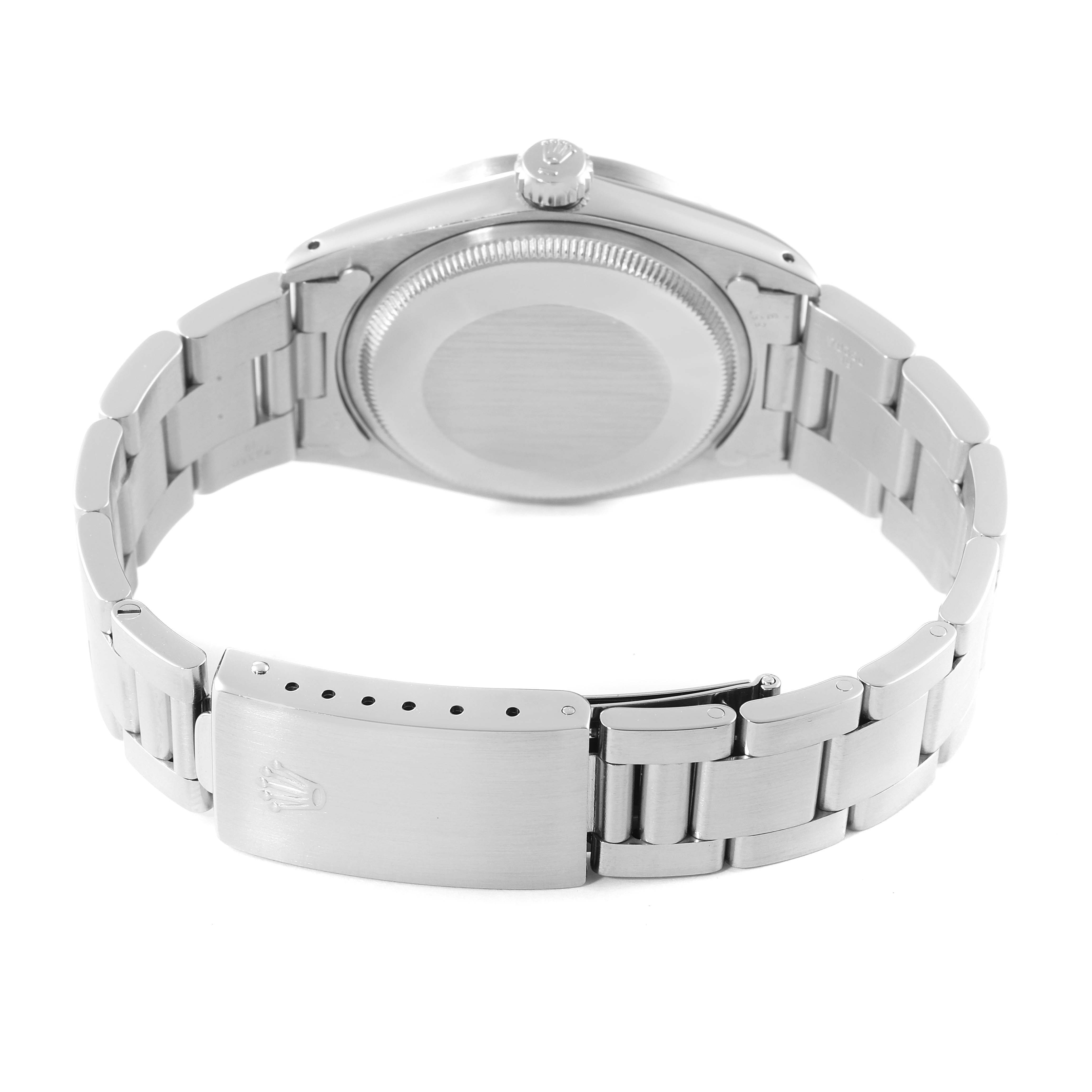 The image shows the back view of a Vintage Collection Rolex watch, highlighting the case back, crown, and metal bracelet with clasp.