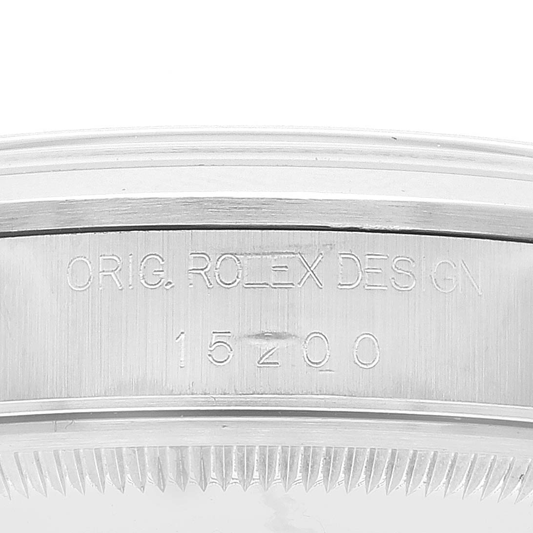 The image shows a close-up of the case body and bezel of the Rolex Date 15200 Men
s Stainless Steel White Dial 15200 Men
s Stainless Steel White Dial model, with engravings "ORIG. ROLEX DESIGN 15200".