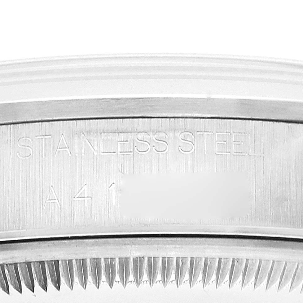 The image shows an angled close-up of the stainless steel case back part of a Rolex Date 15200 Men
s Stainless Steel White Dial 15200 Men
s Stainless Steel White Dial model watch.