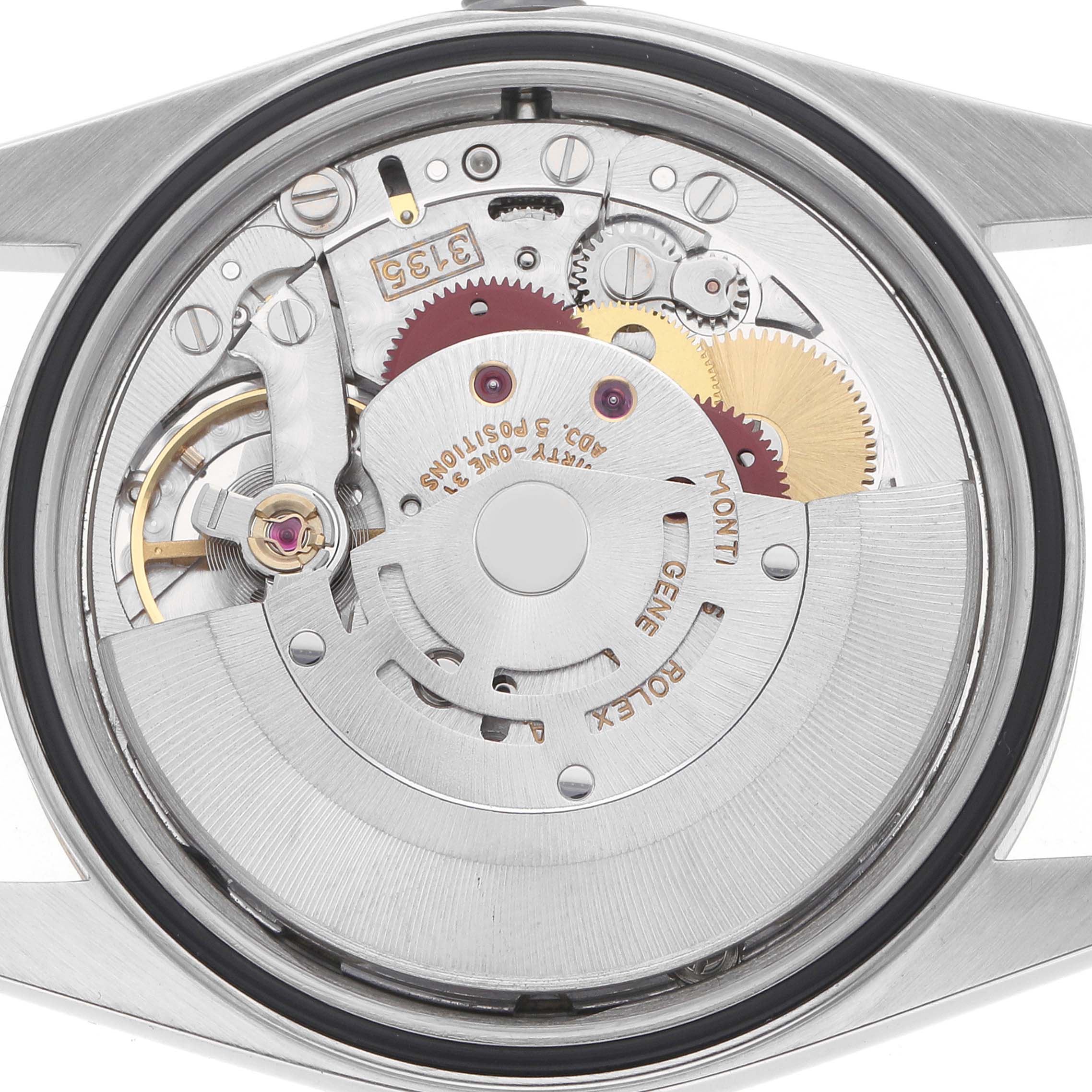 The image shows a close-up of the Rolex Datejust 16233 Men
s Steel and Gold (two tone) Champagne Dial movement from the back, displaying gears and components.
