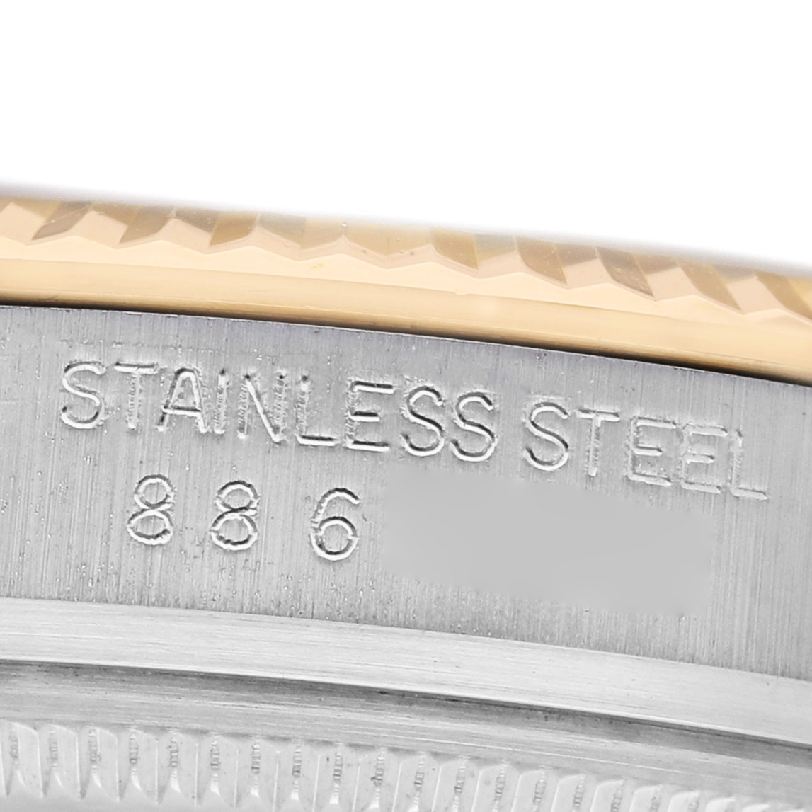 The image shows a close-up of the Rolex Datejust 16013 Men's Stainless Steel Champagne Dial model's bezel and case edge, highlighting the "STAINLESS STEEL" engraving.