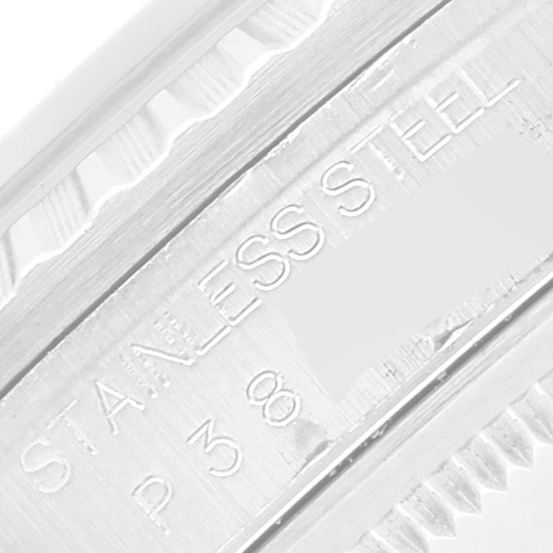 This close-up image shows the engraved details on the stainless steel casing of a Rolex Datejust 16220 Men's Stainless Steel White Dial 16220 Men's Stainless Steel White Dial model.