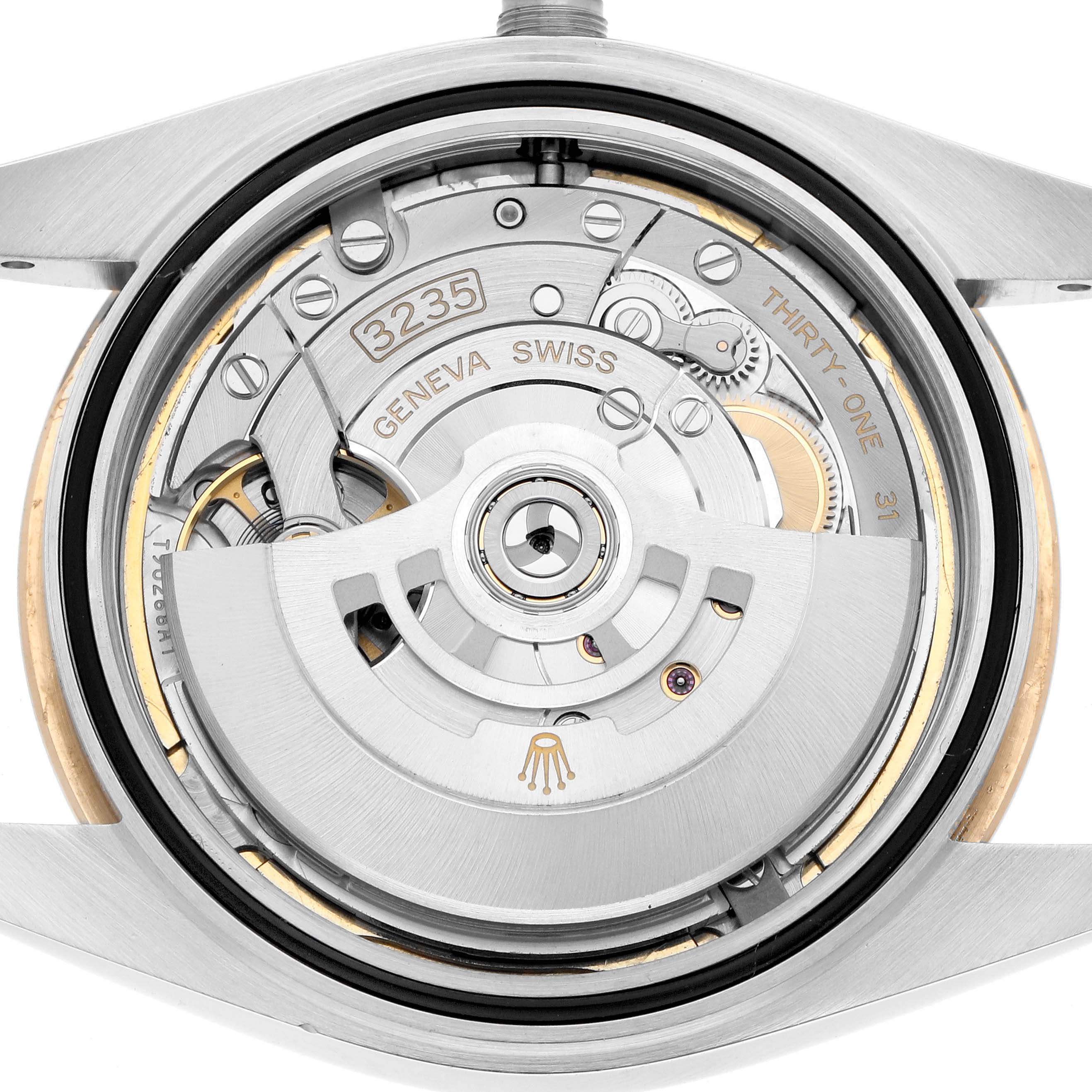 The image shows the movement of a Rolex Datejust 41 126333 Men
s Steel and Gold (two tone) Champagne Dial, focusing on its internal mechanics from the back.