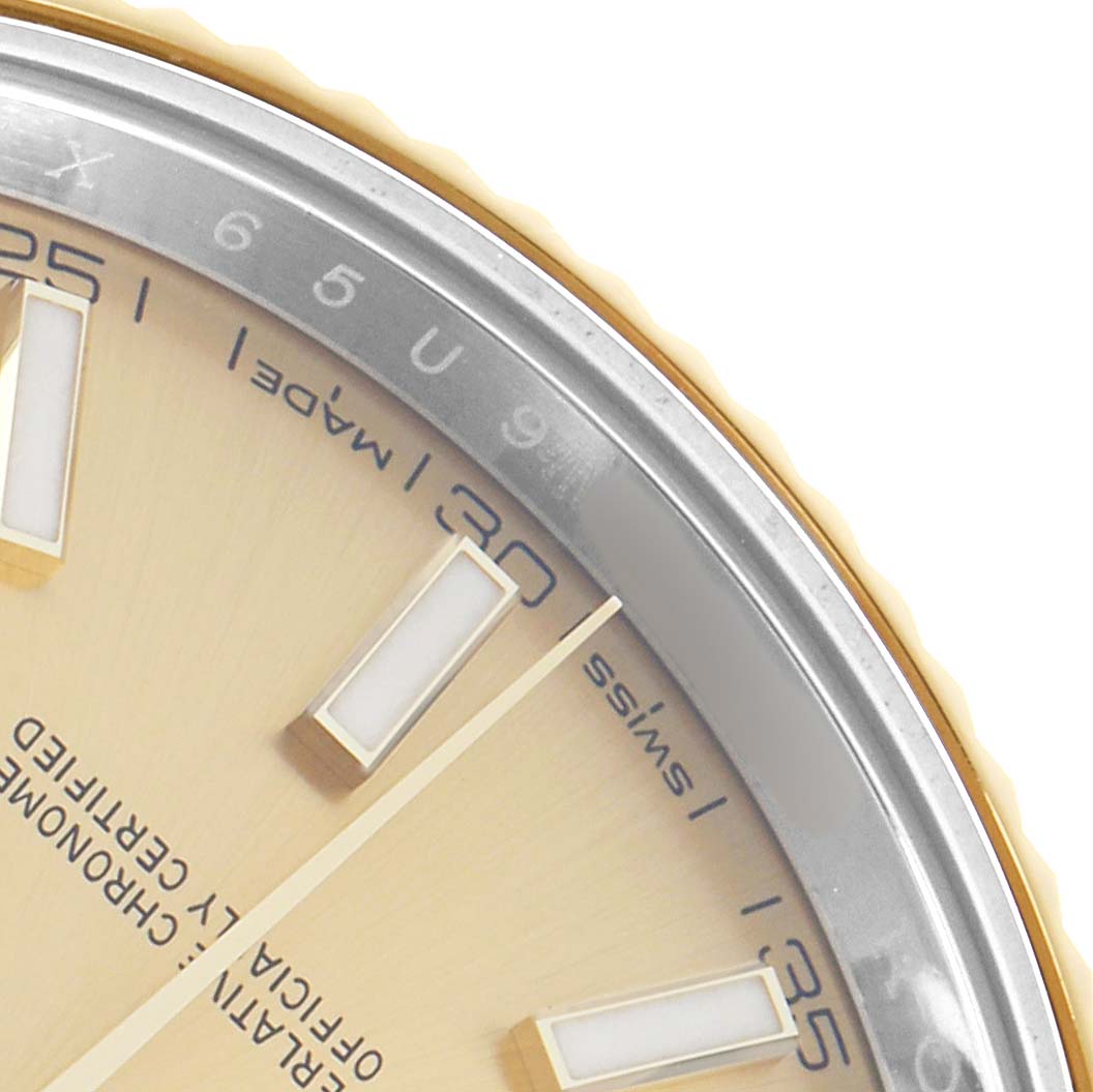 The image shows a close-up of the Rolex Datejust 41 126333 Men
s Steel and Gold (two tone) Champagne Dial, highlighting the dial, markers, and partial bezel.
