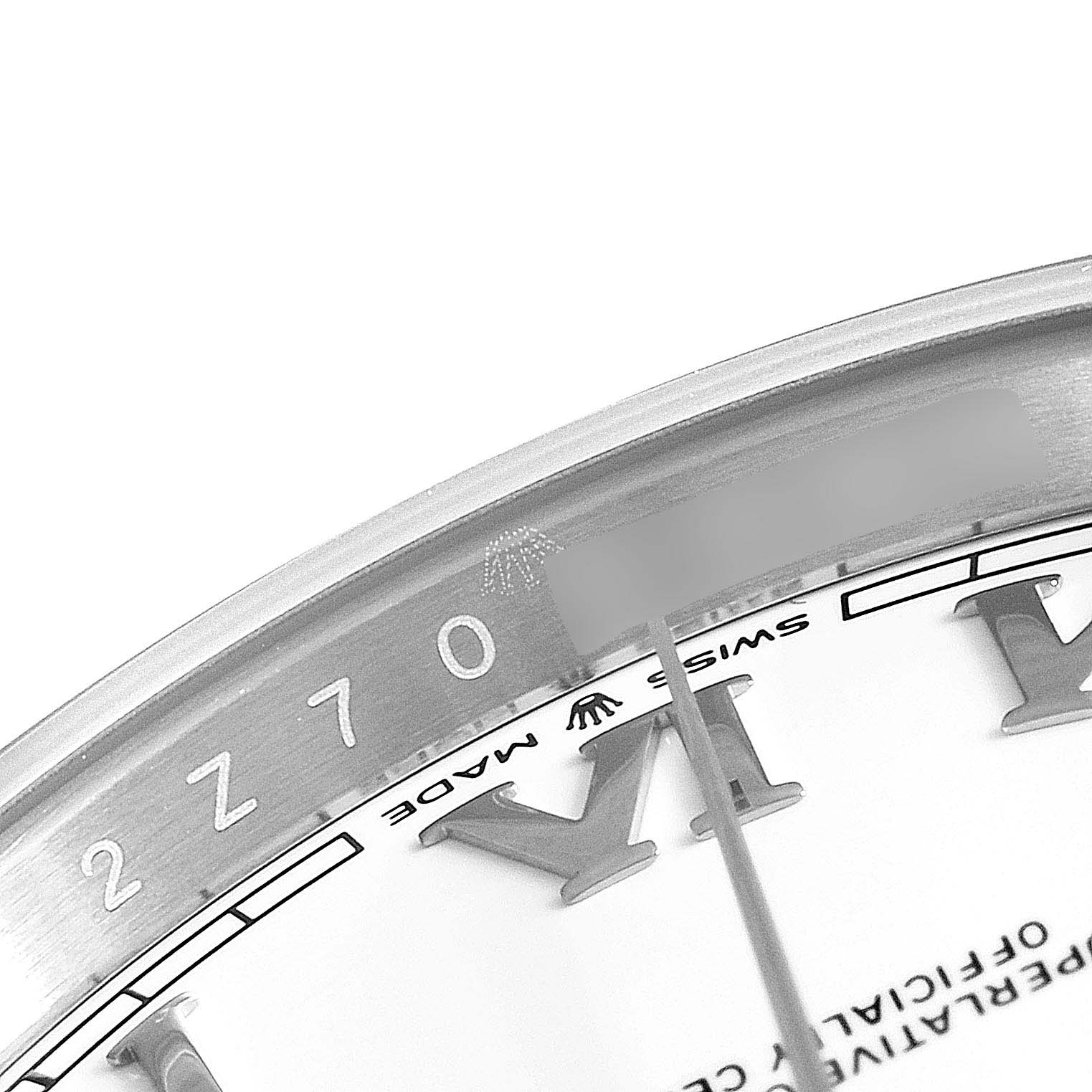 The image shows a close-up angle of the Rolex Datejust 41 126300 Men's Stainless Steel White Dial 126300 Men's Stainless Steel White Dial watch, focusing on the dial and bezel area, highlighting the "Swiss Made" marking and part of the serial number.