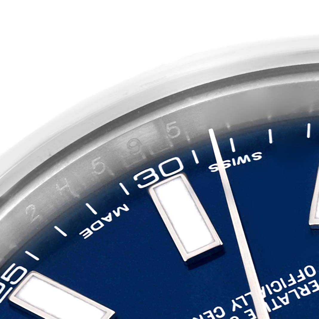 The image shows a close-up of the Datejust 41 model by Rolex, highlighting part of its bezel, markers, and dial.