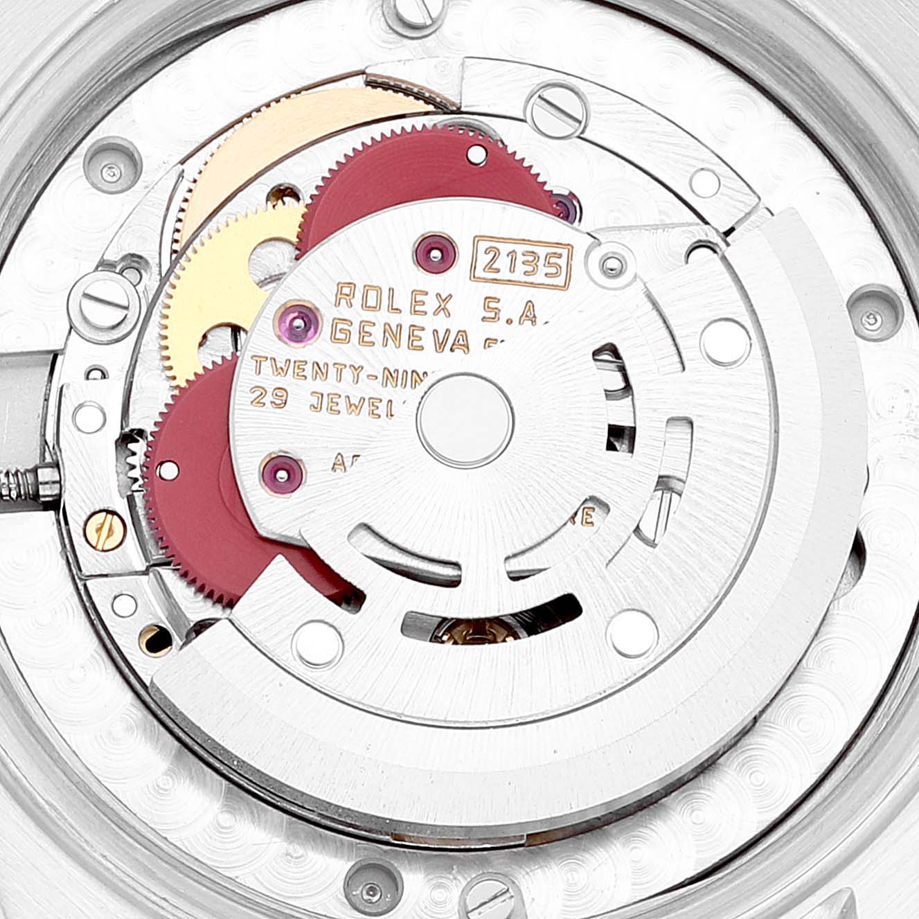 This close-up image shows the movement mechanism of a Rolex Mid-Size 68273 Women's Steel and Gold (two tone) Black Dial 68273 Women's Steel and Gold (two tone) Black Dial model, focusing on the gears and inscriptions.