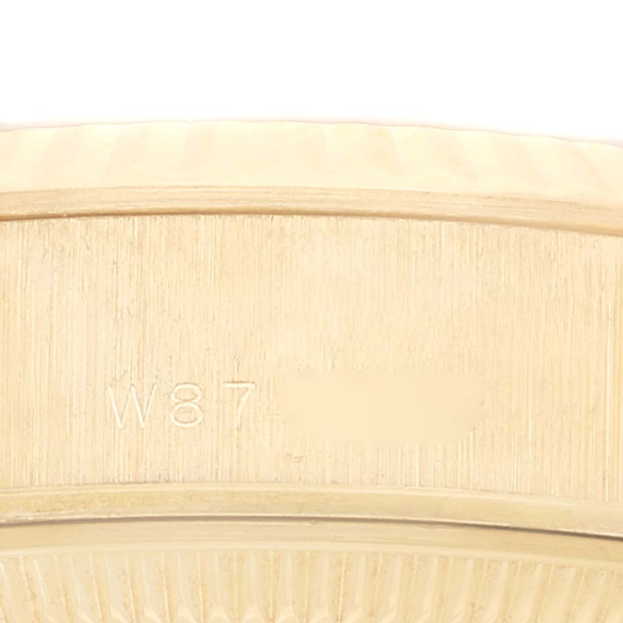 The image shows a close-up of the Rolex President 69178 Women's Yellow Gold Champagne Dial 69178 Women's Yellow Gold Champagne Dial model's clasp with part of its serial number visible.