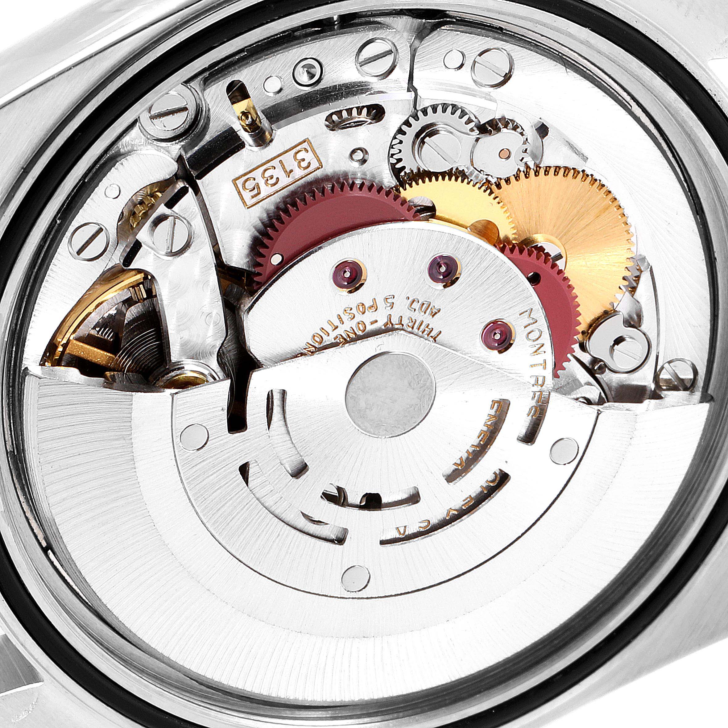 The image shows the internal mechanism of a Rolex Datejust 16233 Men
s Steel and Gold (two tone) Champagne Dial 16233 Men
s Steel and Gold (two tone) Champagne Dial watch, highlighting gears and components at a close-up angle.