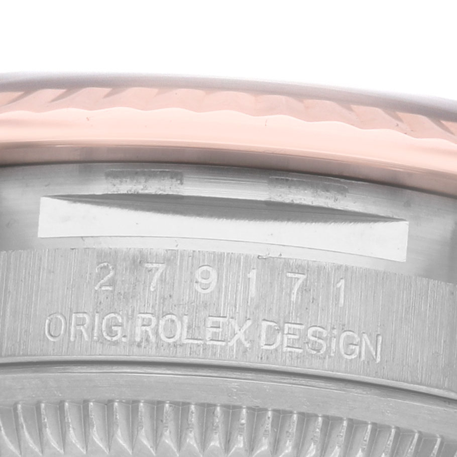 The image shows the case side and edge of the bezel of a Rolex Datejust 279171 Women's Steel and Gold (two tone) Brown Dial watch, with engraved details.