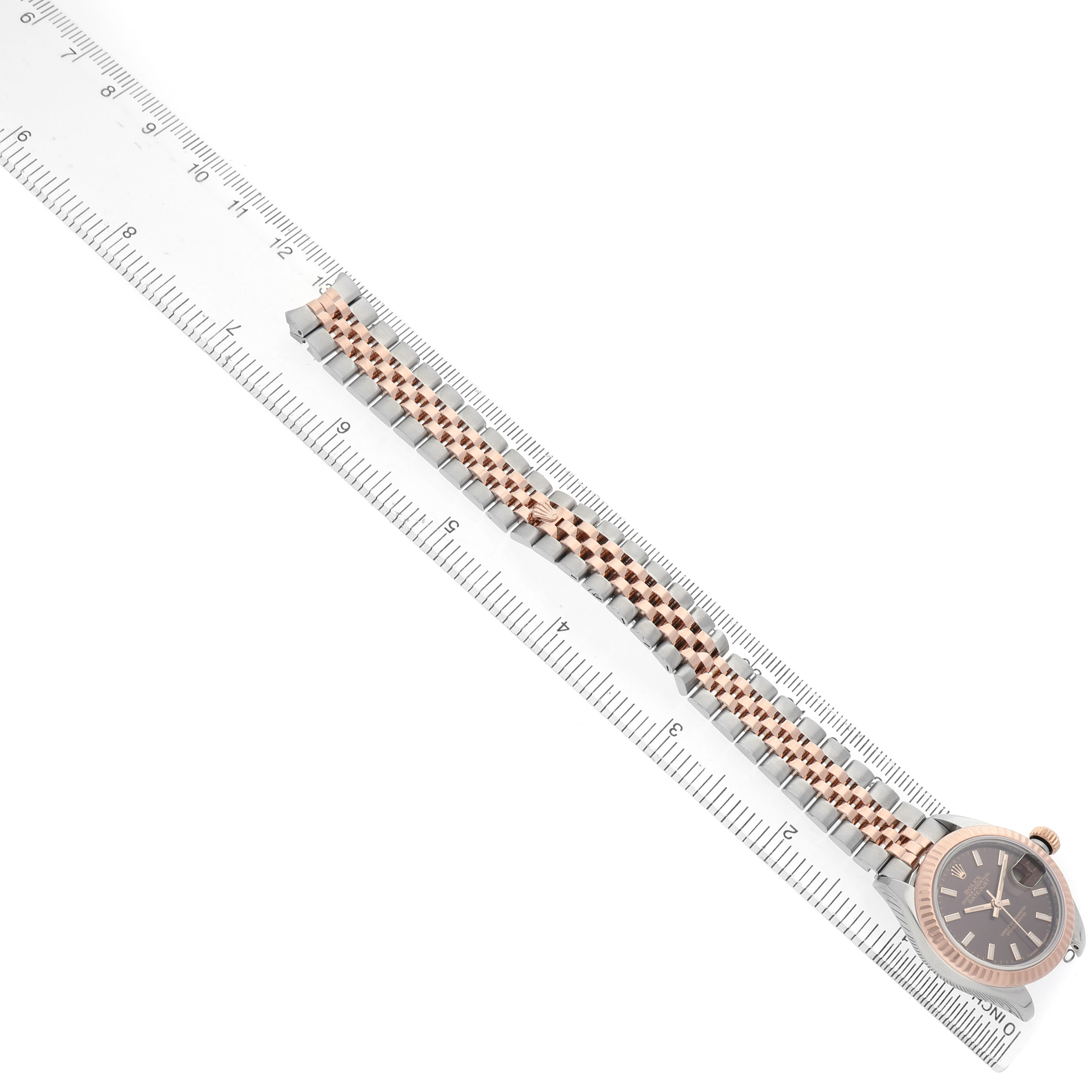 The image shows a side view of a Rolex Datejust 279171 Women's Steel and Gold (two tone) Brown Dial watch with a focus on the band and a partial view of the face.