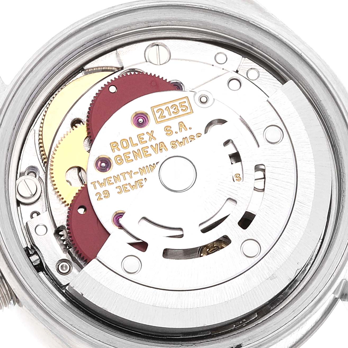 The image shows the internal mechanism of a Rolex Datejust 69174 Women's Stainless Steel Blue Dial 69174 Women's Stainless Steel Blue Dial watch, specifically focusing on the movement and gears.