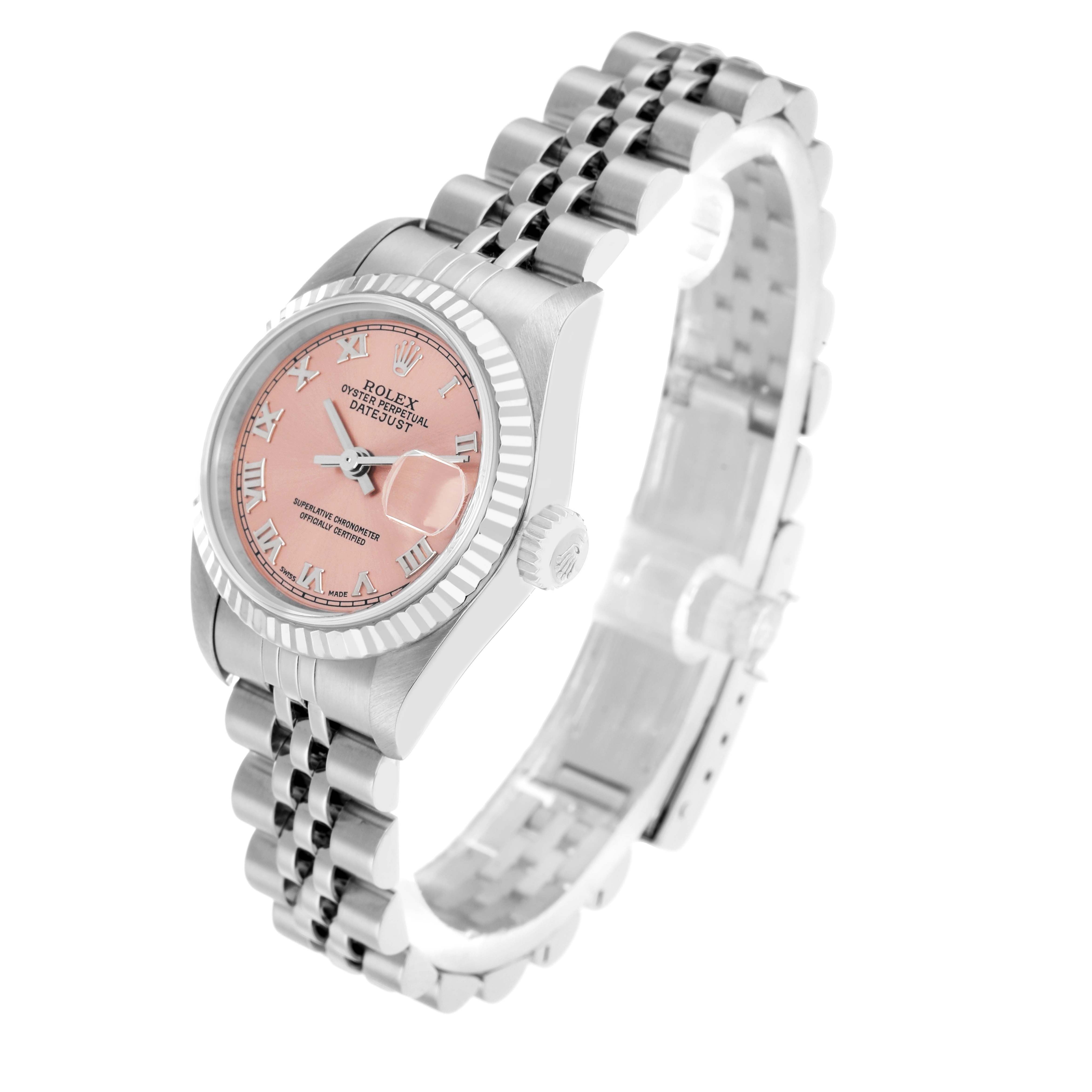 The Rolex Datejust 79174 Women
s Stainless Steel Pink Dial watch is shown at a three-quarter angle, highlighting the pink dial, fluted bezel, and Jubilee bracelet.
