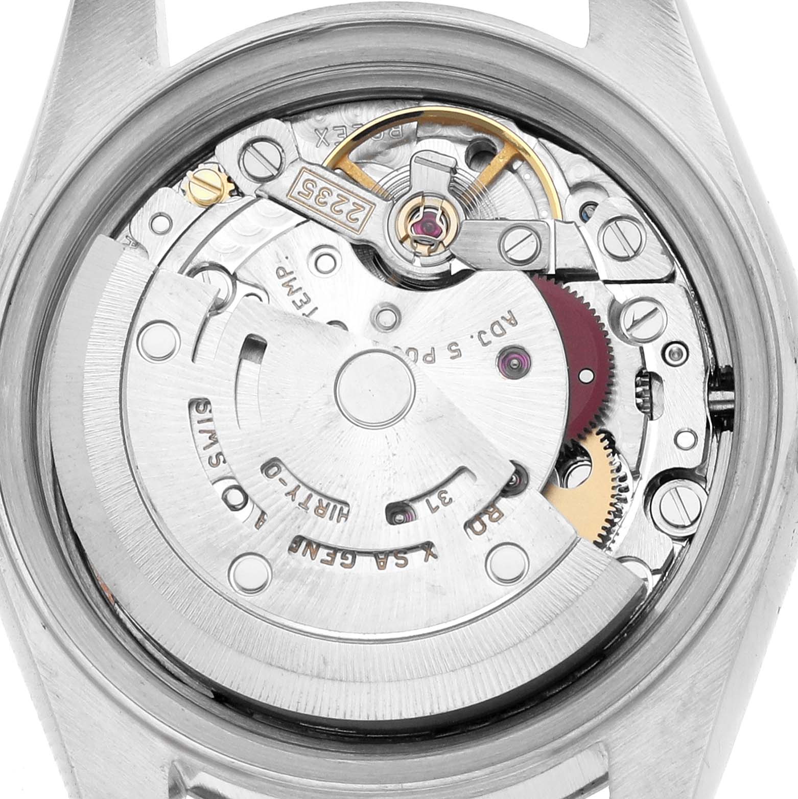 The image shows the movement of a Rolex Datejust 79174 Women
s Stainless Steel Pink Dial from a back angle, highlighting its intricate gears and components.