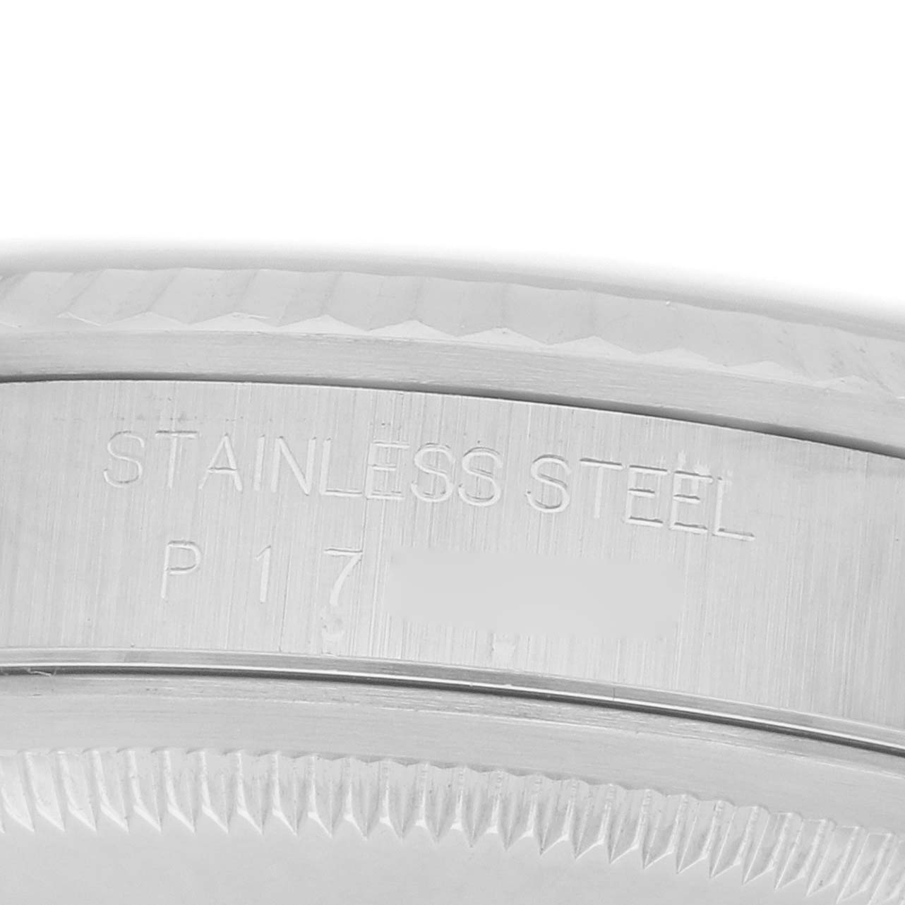 The image shows a close-up of the side view, focusing on the stainless steel case with engravings on a Rolex Datejust 16234 Men
s Stainless Steel Silver Dial.
