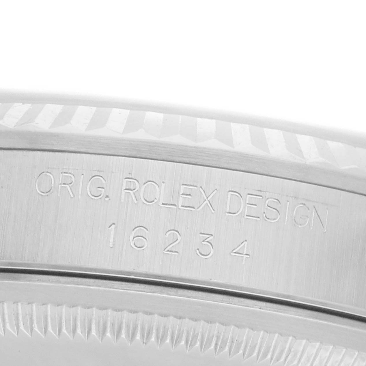 The image shows the side engraving of a Rolex Datejust 16234 Men
s Stainless Steel Silver Dial watch with model number 16234.