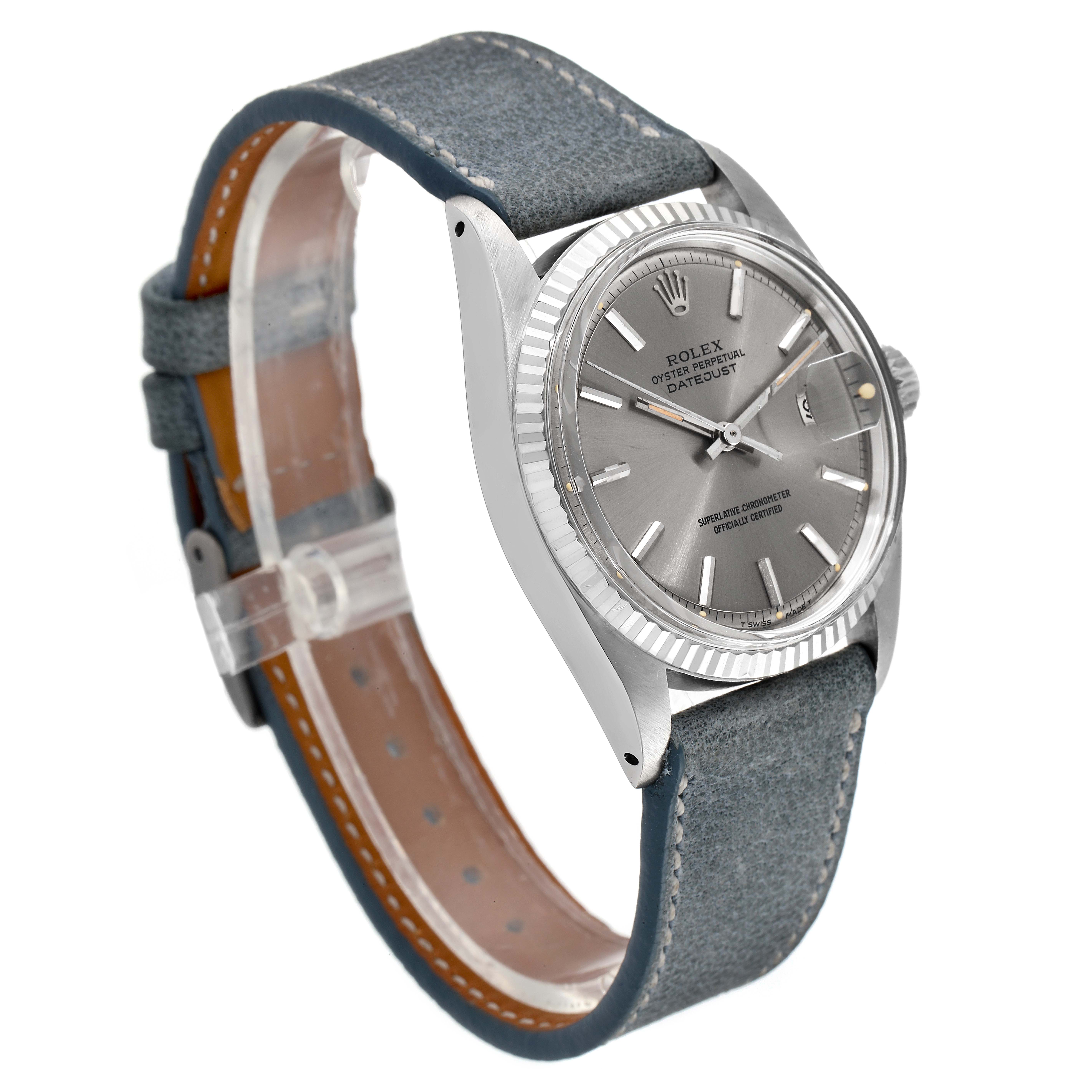 The Rolex Vintage Collection 1601 Men's Stainless Steel Grey Dial 1601 Men's Stainless Steel Grey Dial model is shown from an angled side view, featuring its grey dial, fluted bezel, and leather strap.